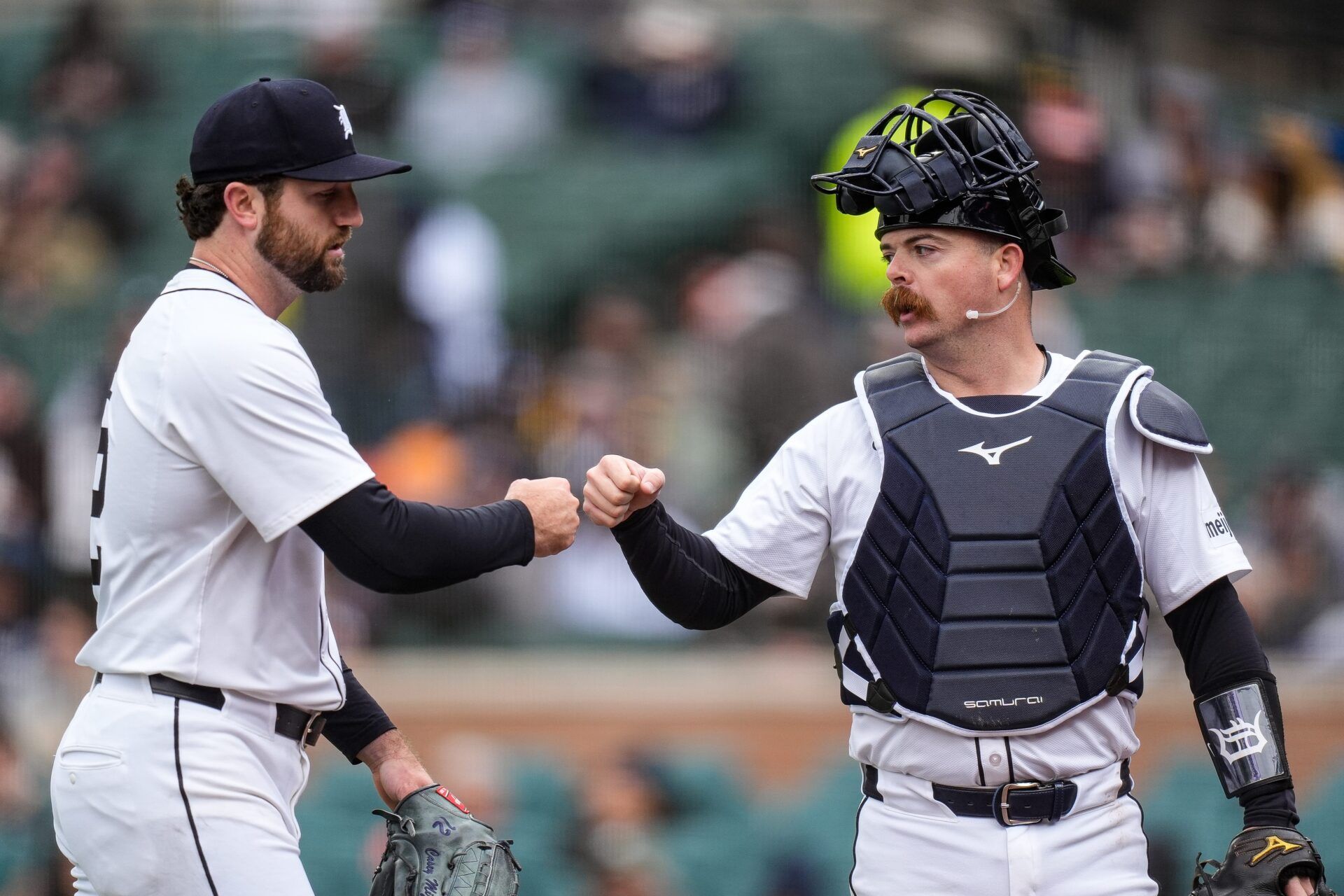 Detroit Tigers pitcher Casey Mize (12) first bumps catcher Jake Rogers (34) after pitching against New York Yankees during the third inning at Comerica Park in Detroit on Monday, April 7, 2025.