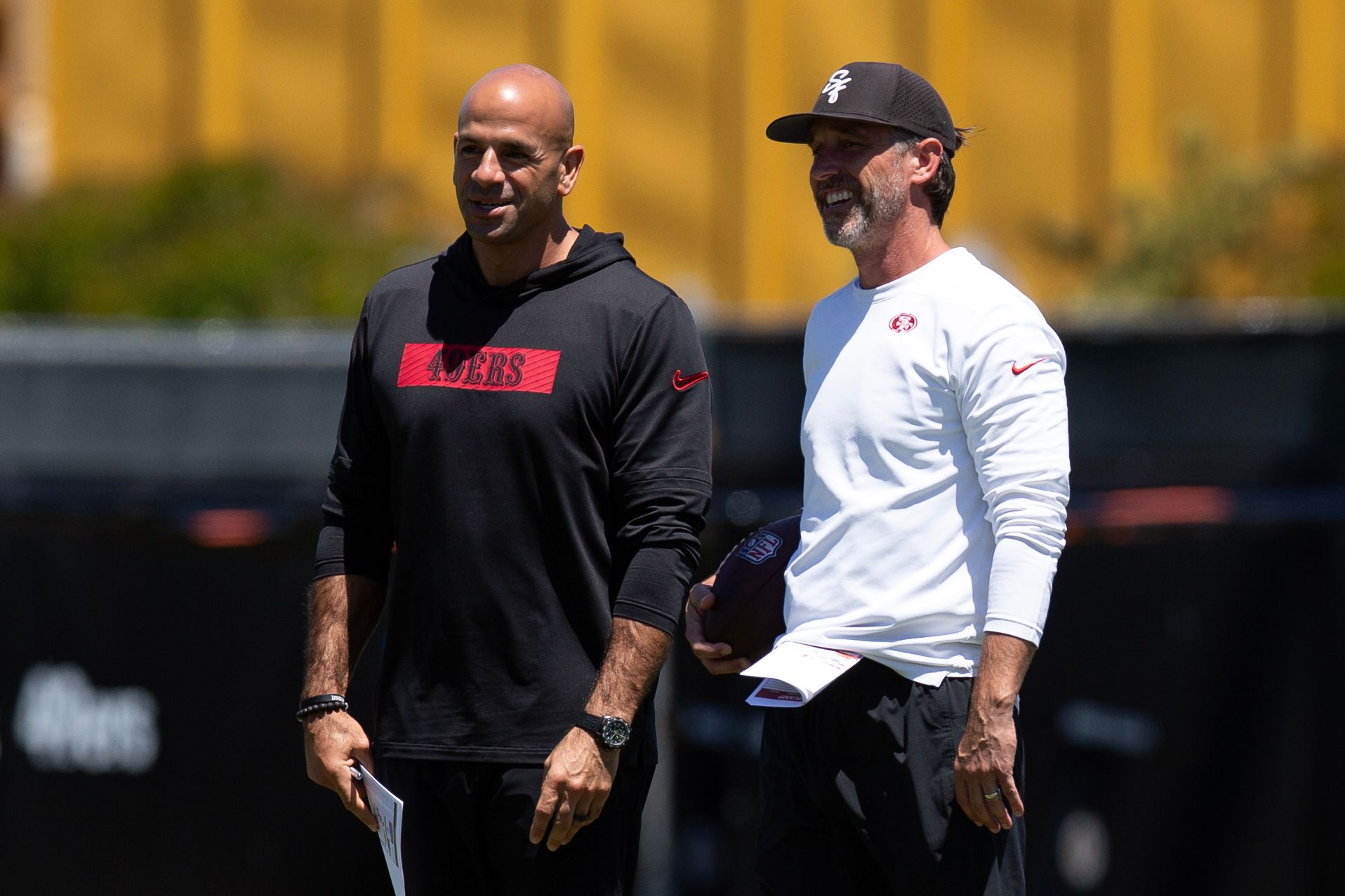 San Francisco 49ers head coach Kyle Shanahan, right, confers with defensive coordinator Robert Saleh during the teams rookie minicamp.