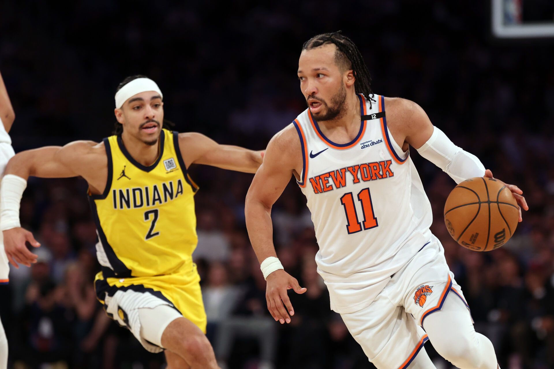 New York Knicks guard Jalen Brunson (11) controls the ball against Indiana Pacers guard Andrew Nembhard (2) in the fourth quarter during game five of the eastern conference finals for the 2025 NBA Playoffs at Madison Square Garden.