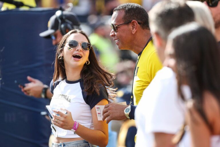 Alex Rodriguez with his daughter, U-M freshman Natasha Rodriguez, watch the game from behind the end zone during the first half at Michigan Stadium in Ann Arbor on Saturday, Sept. 9, 2023.