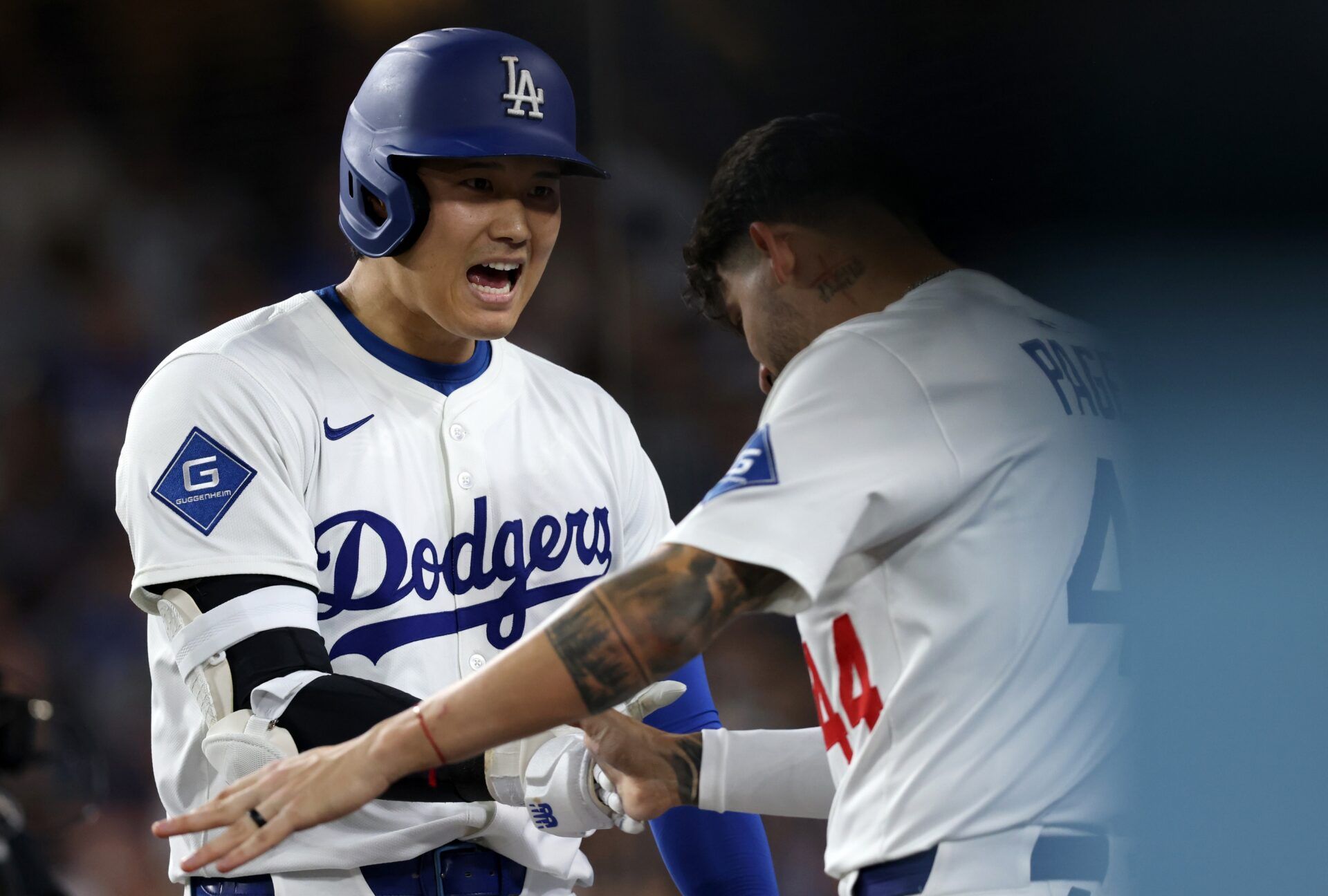 Los Angeles Dodgers designated hitter Shohei Ohtani (17) celebrates with outfielder Andy Pages (44) after hitting a home run during the sixth inning against the New York Yankees at Dodger Stadium.