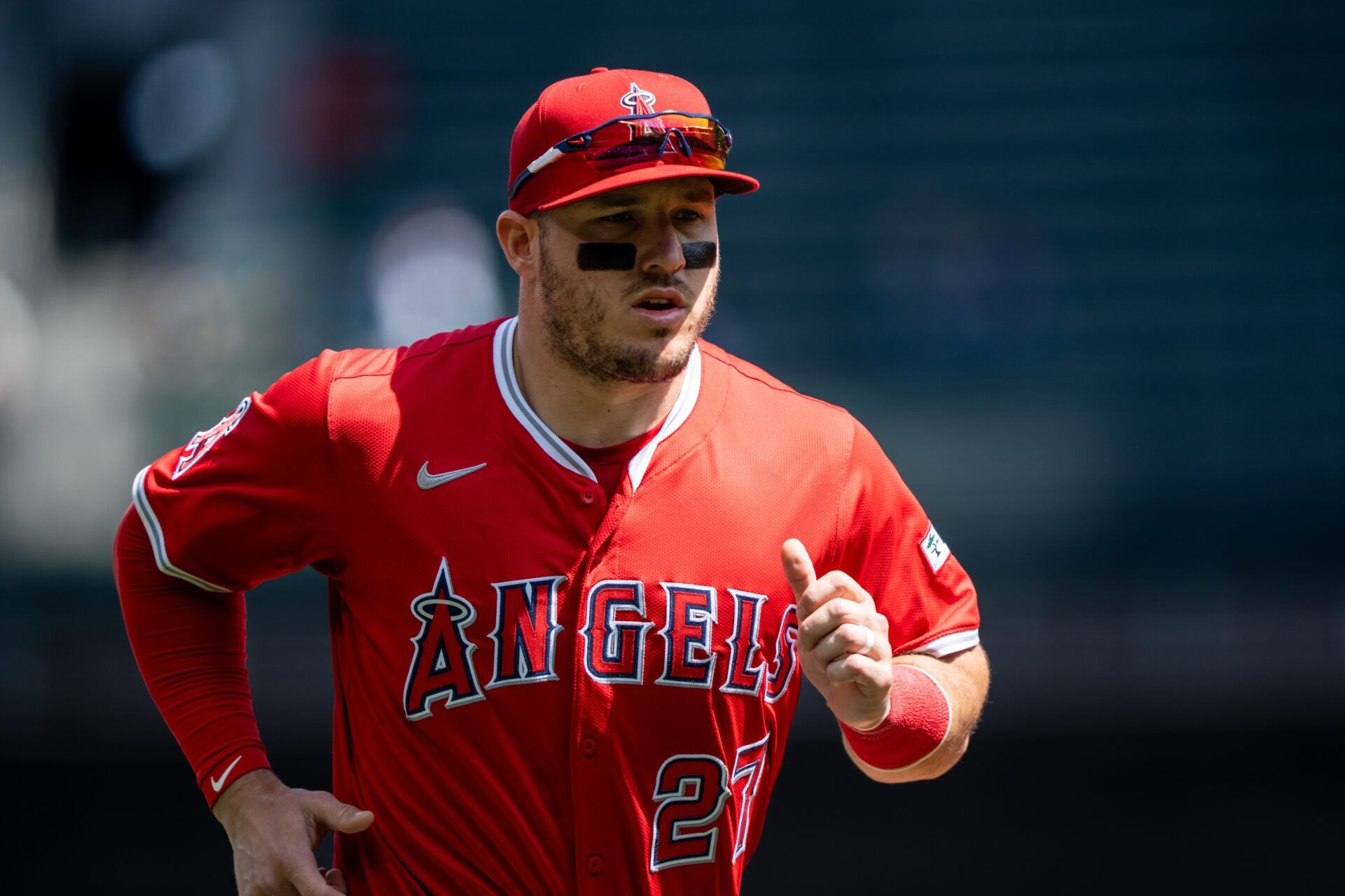 Los Angeles Angels right fielder Mike Trout (27) jogs off the field before a game against the Seattle Mariners at T-Mobile Park.