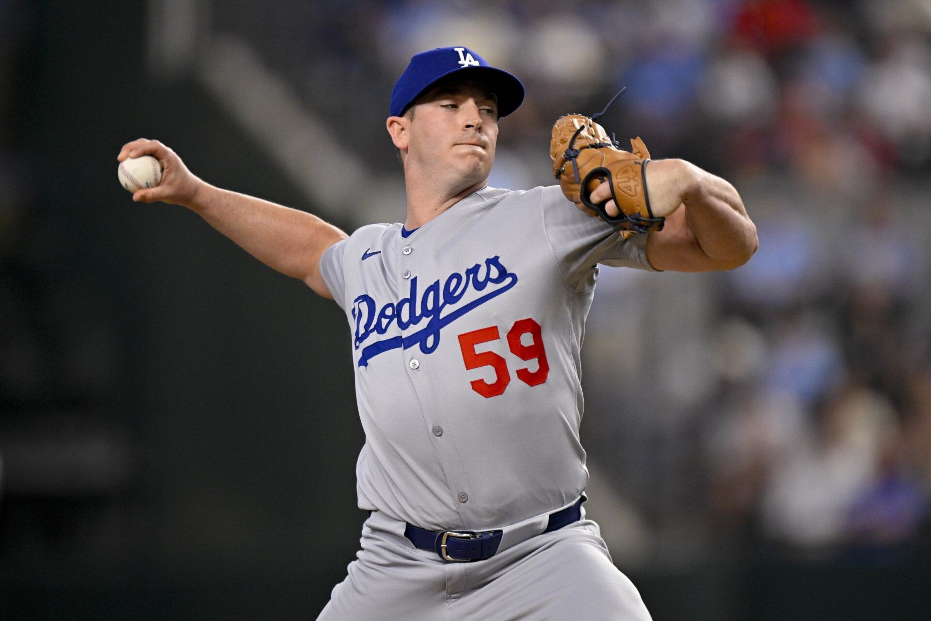 Los Angeles Dodgers relief pitcher Evan Phillips (59) pitches during the game between the Texas Rangers and the Los Angeles Dodgers at Globe Life Field.