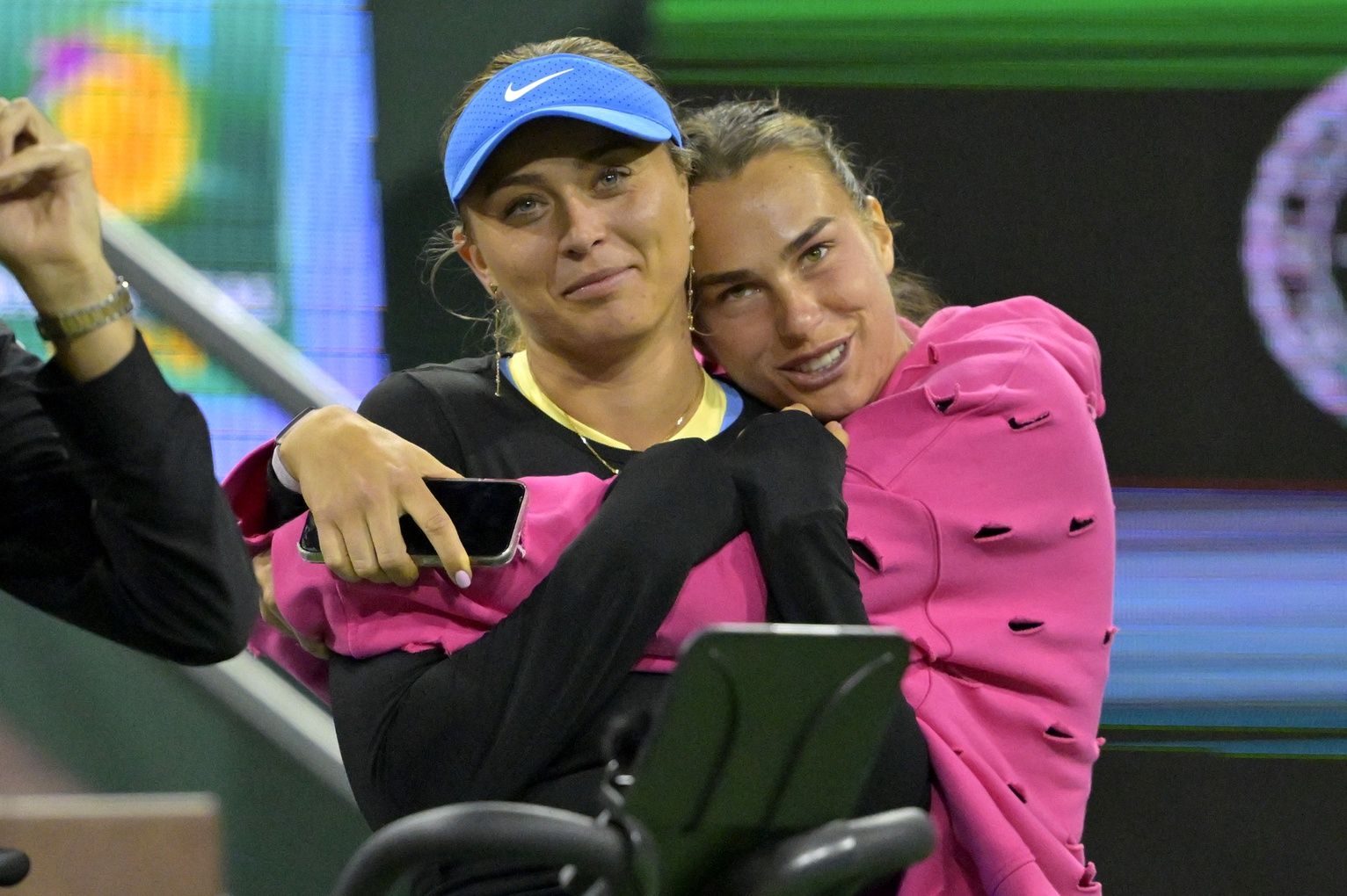Paula Badosa and Aryna Sabalenka watch action in the Eisenhower Cup Tie Break Tens event featuring mixed doubles during the BNP Paribas Open at the Indian Wells Tennis Garden.