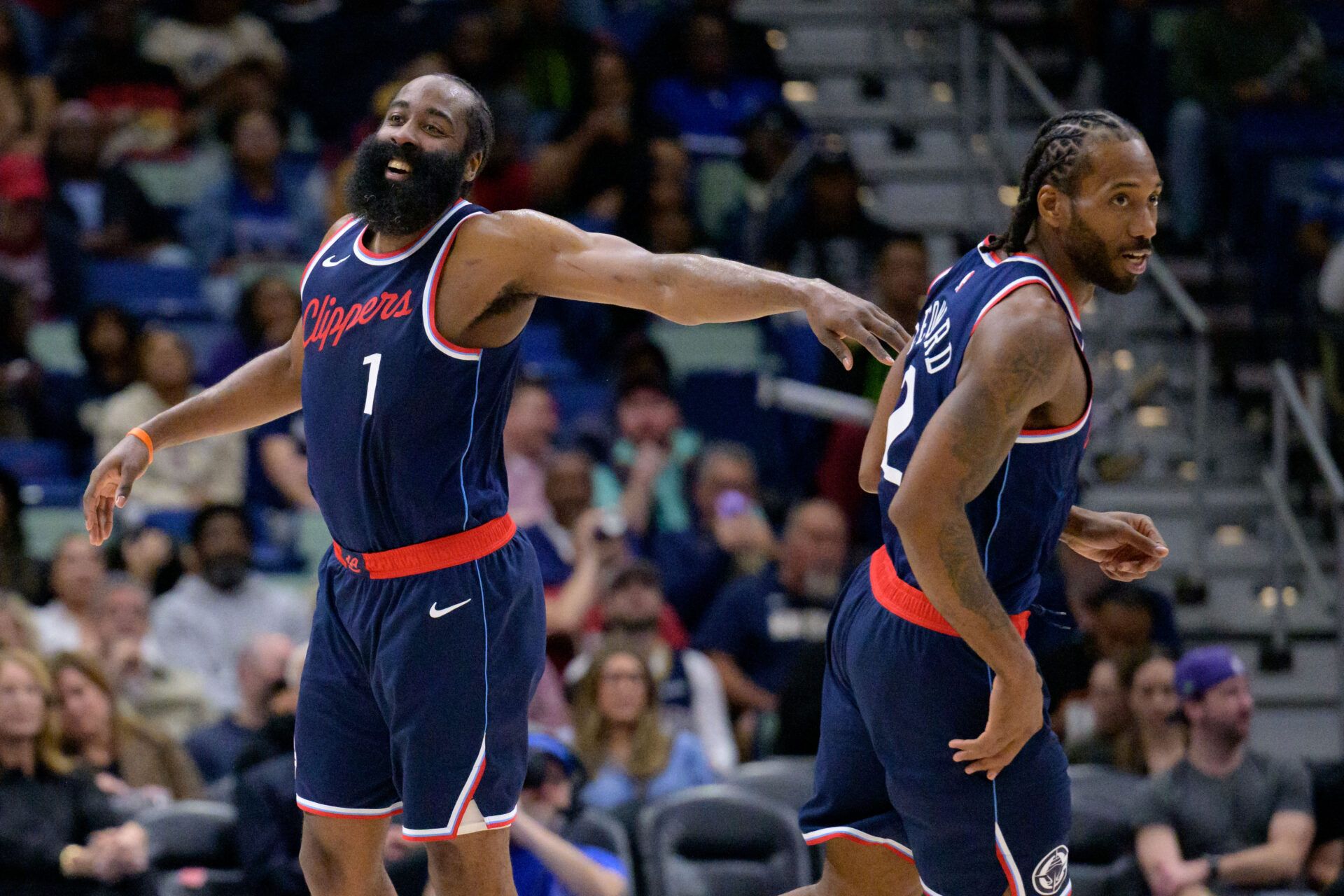 Los Angeles Clippers forward Kawhi Leonard (2) and Los Angeles Clippers guard James Harden (1) react  during the second half against the New Orleans Pelicans at Smoothie King Center.