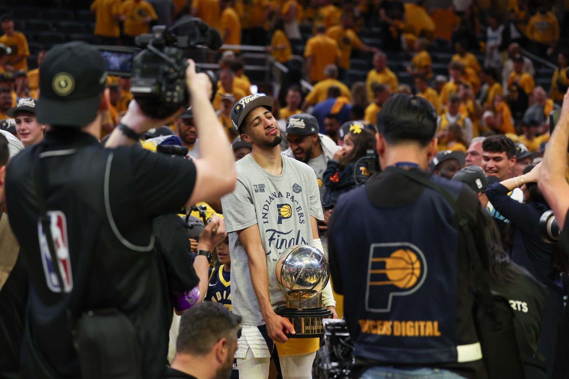 Indiana Pacers guard Tyrese Haliburton (0) holds the trophy after game six of the eastern conference finals against the New York Knicks for the 2025 NBA Playoffs at Gainbridge Fieldhouse.