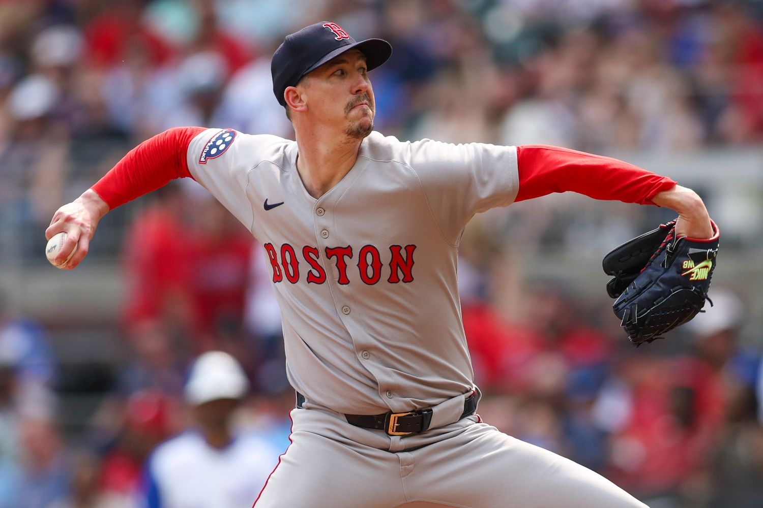 Boston Red Sox starting pitcher Walker Buehler (0) throws against the Atlanta Braves in the second inning at Truist Park.