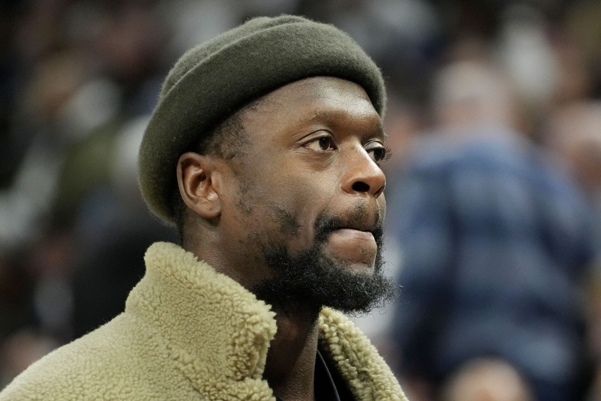 Minnesota Timberwolves forward Julius Randle (30) watches as his team huddles during a timeout in the third quarter of the game with the Sacramento Kings at Target Center.