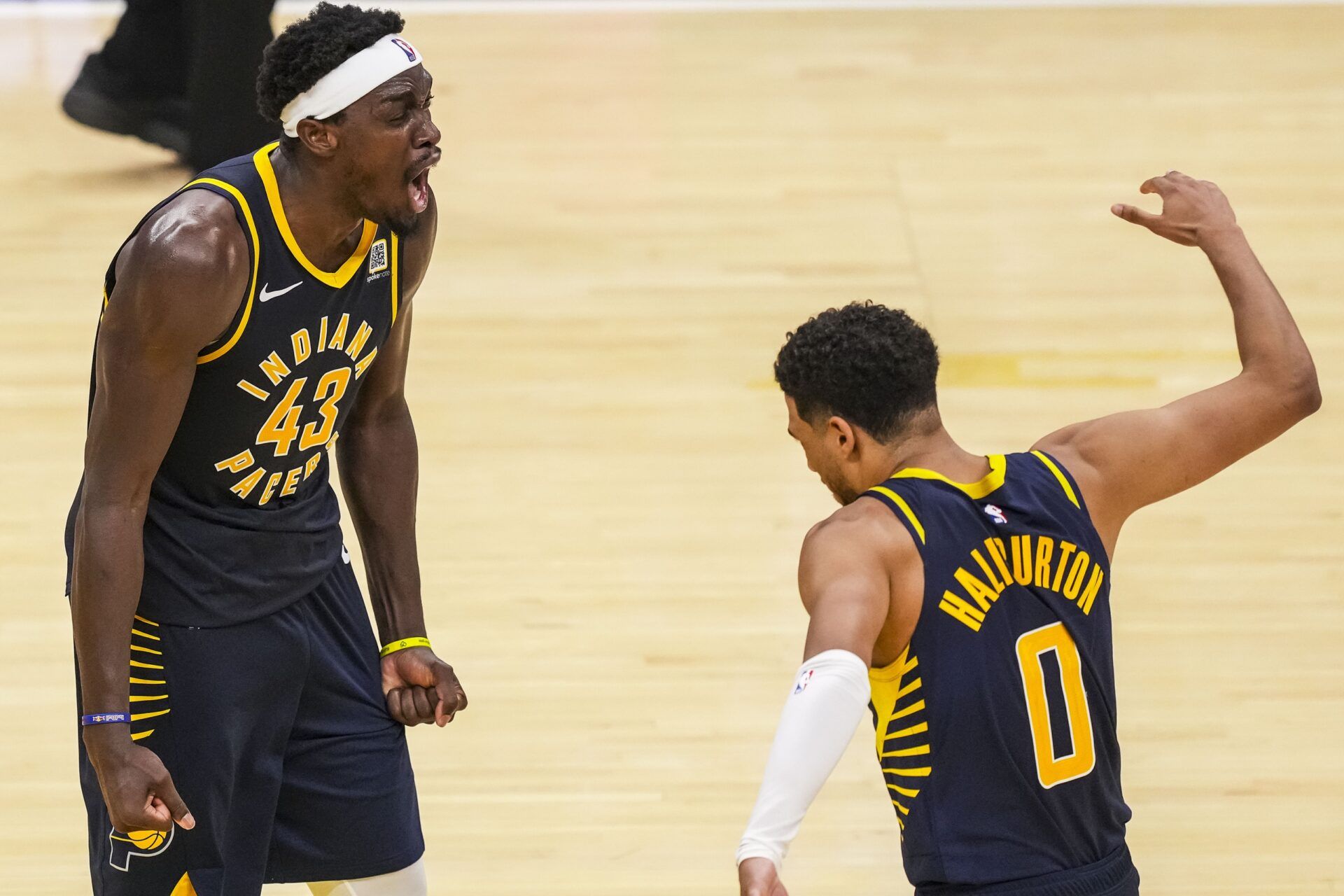 Indiana Pacers forward Pascal Siakam (43) and guard Tyrese Haliburton (0) celebrate Siakam’s game-winning three point basket against the Boston Celtics at Gainbridge Fieldhouse.