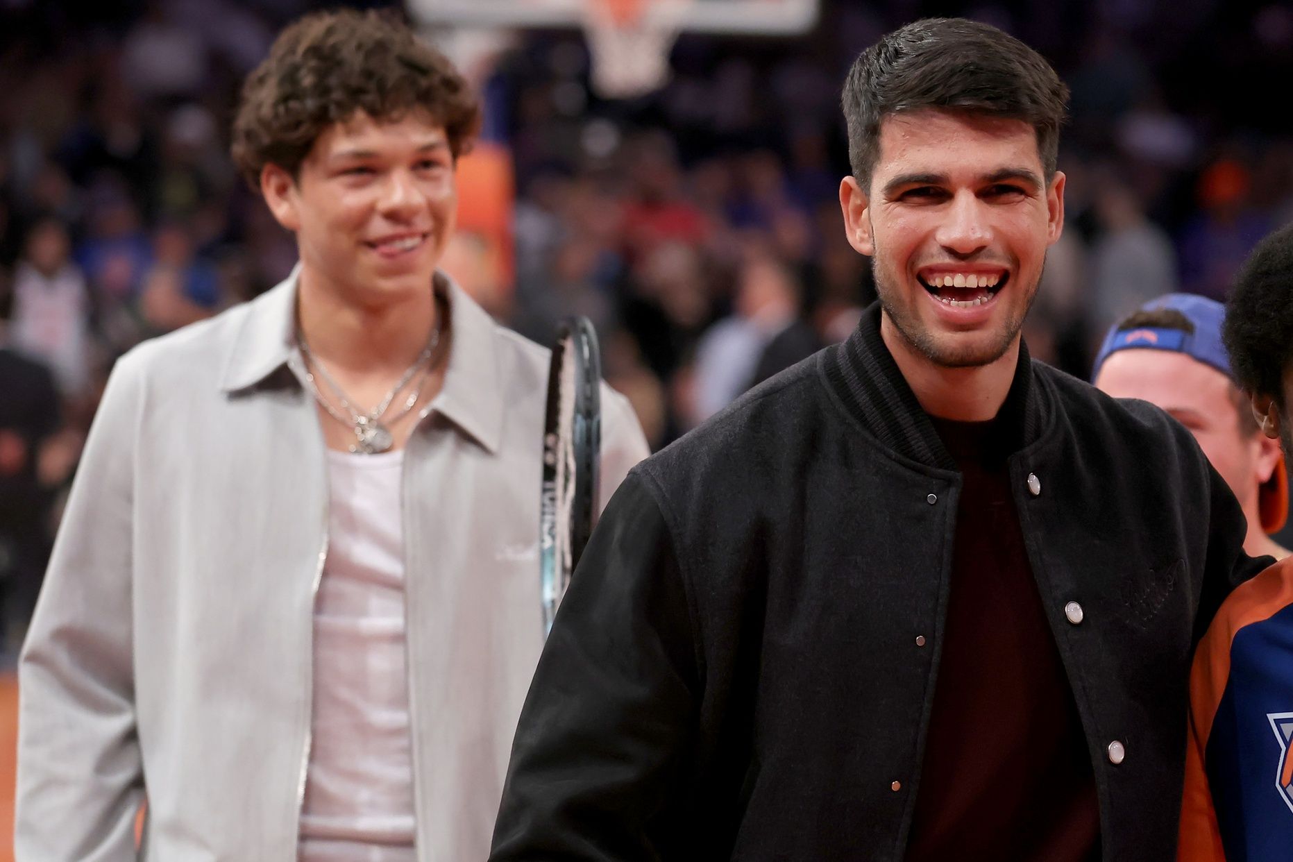 Spanish tennis player Carlos Alcaraz (right) and American player Ben Shelton walk off the court after hitting tennis balls into the crows during the third quarter between the New York Knicks and the Orlando Magic at Madison Square Garden.