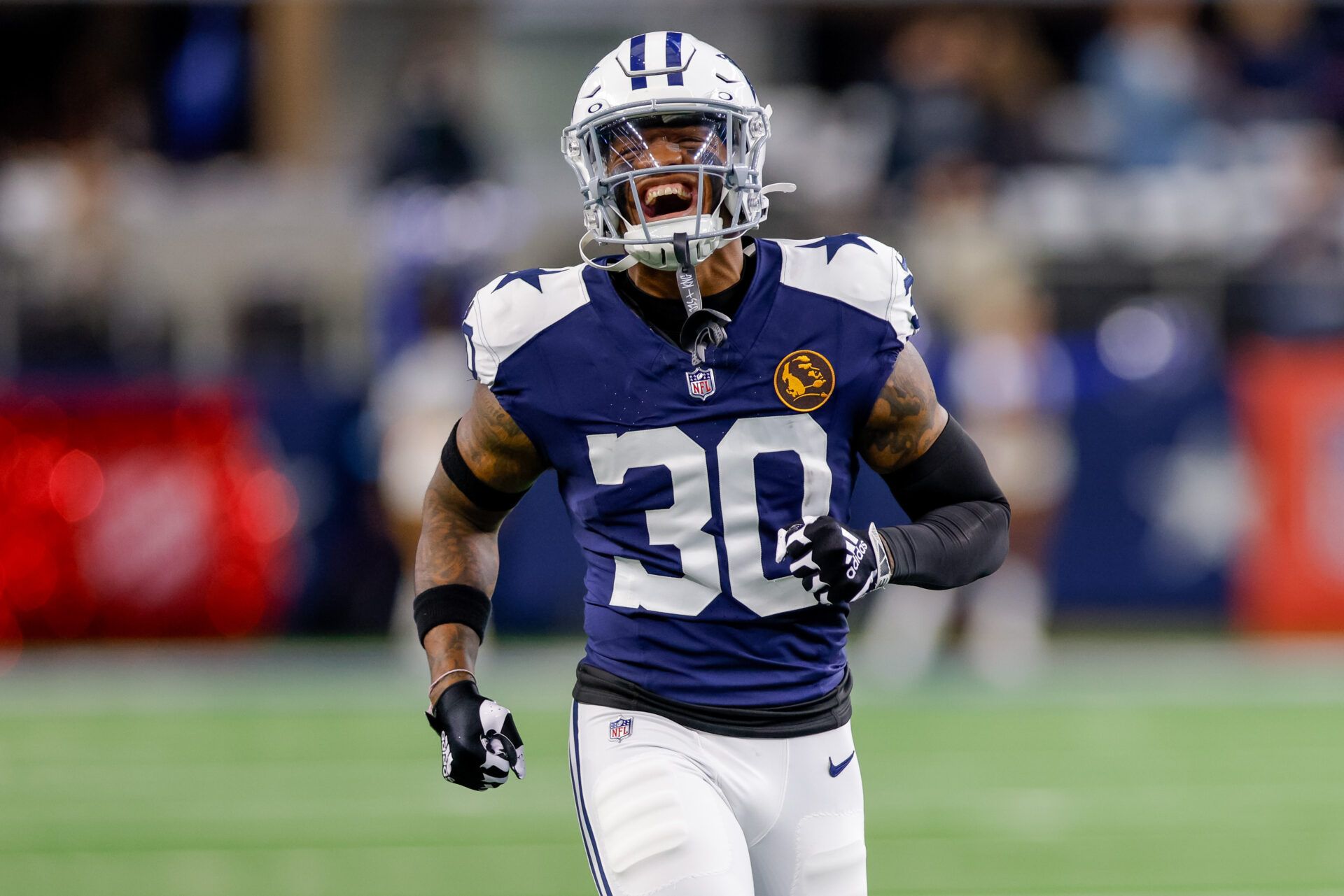 Dallas Cowboys safety Juanyeh Thomas (30) runs on to the field prior to the game against the New York Giants at AT&T Stadium.