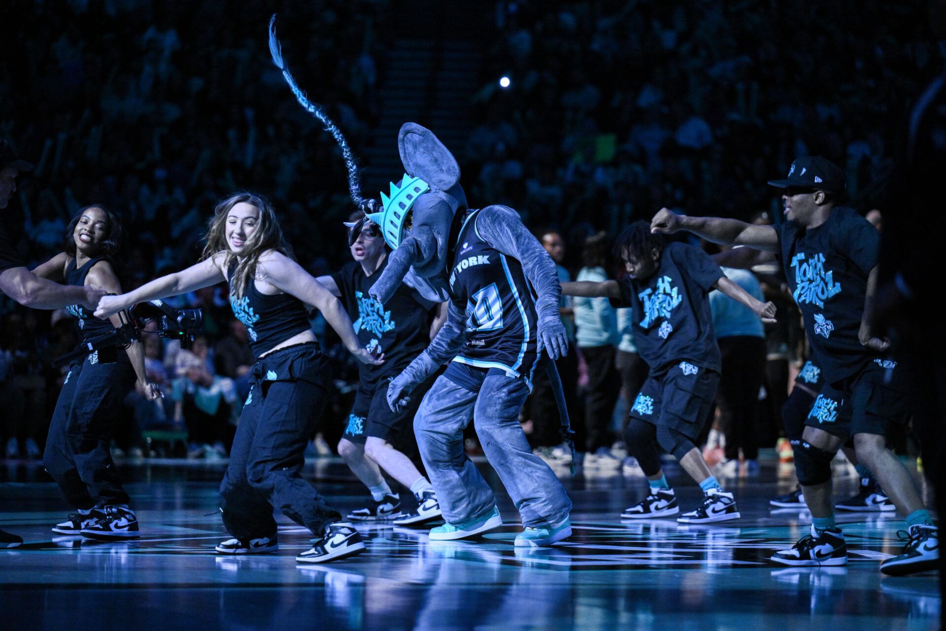 New York Liberty mascot Ellie the Elephant and the Torch Patrol perform during the second half of a game between the New York Liberty and the Connecticut Sun at Barclays Center.