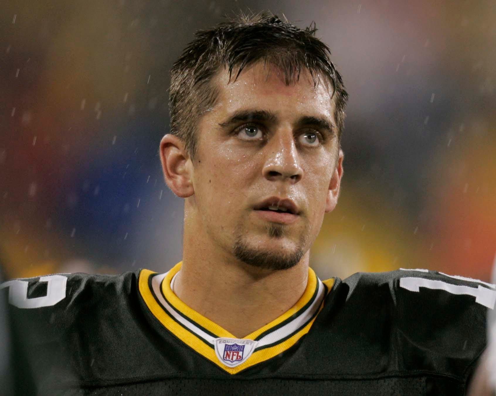 Green Packers quarterback Aaron Rodgers stands on the sidelines during a preseason game against the New England Patriots on Friday, Aug. 26, 2005, at Lambeau Field in Green Bay, Wisconsin.
