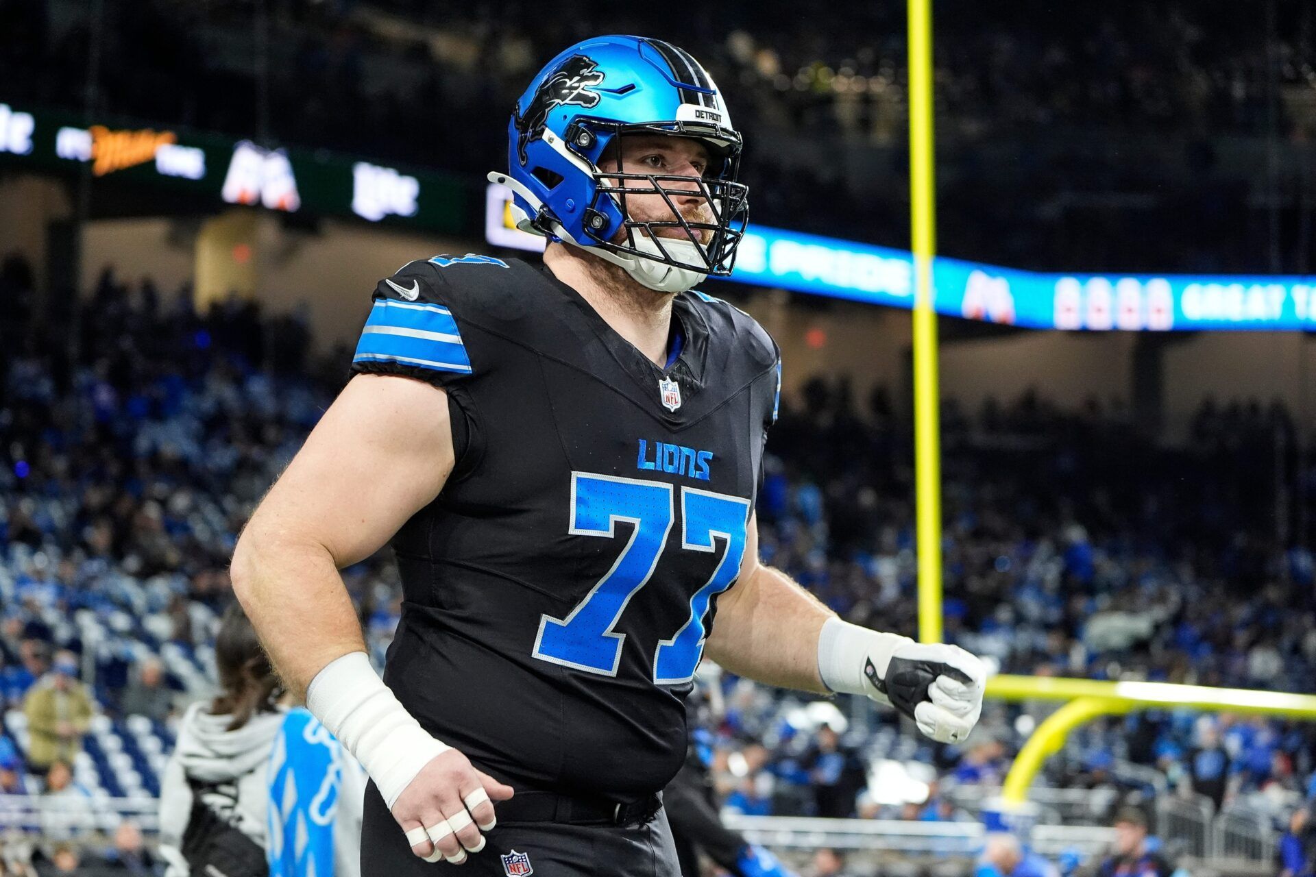 Detroit Lions center Frank Ragnow (77) warm up before the game between Detroit Lions and Buffalo Bills at Ford Field in Detroit on Sunday, Dec. 15, 2024.