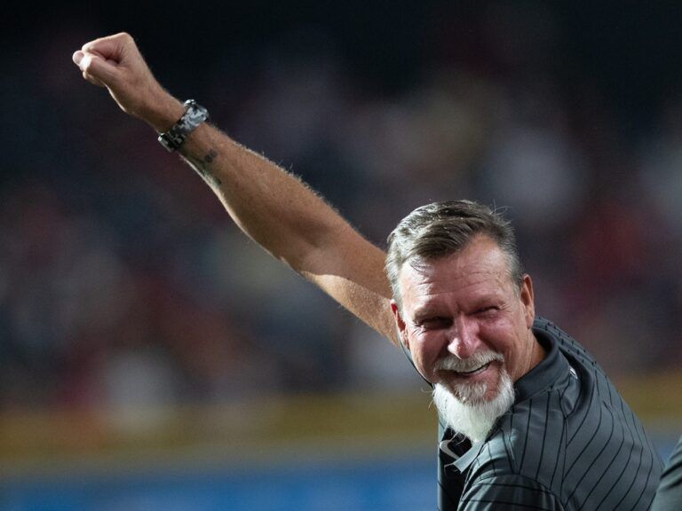 Randy Johnson pumps a fist after his home run was played on the video board at the Arizona Diamondbacks Hall of Fame on July 27, 2024 at Chase Field in Phoenix.
