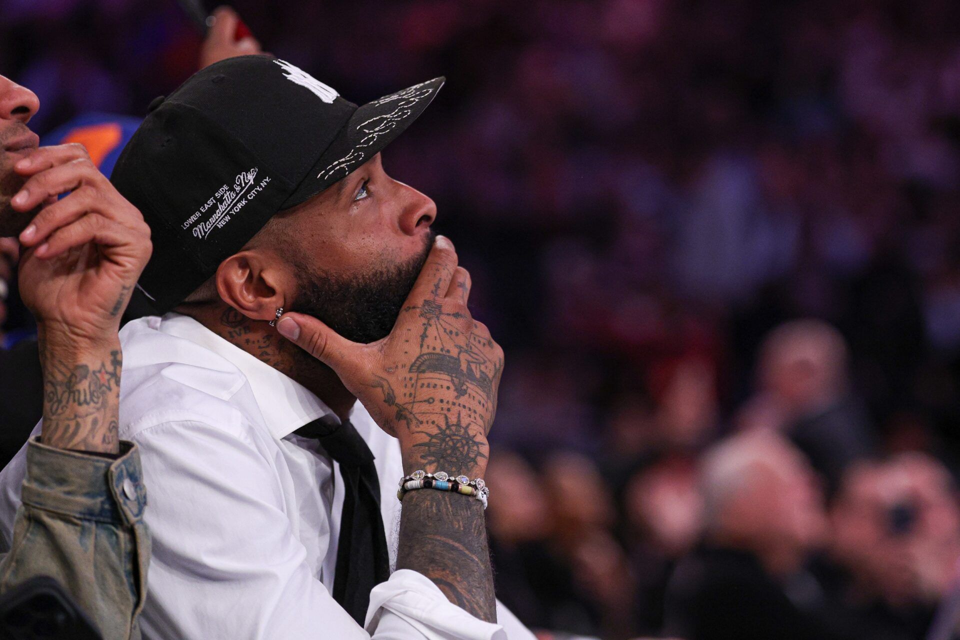 NFL wide receiver Odell Beckham Jr. sits courtside during the second half of the NBA game between the New York Knicks and the Phoenix Suns at Madison Square Garden.