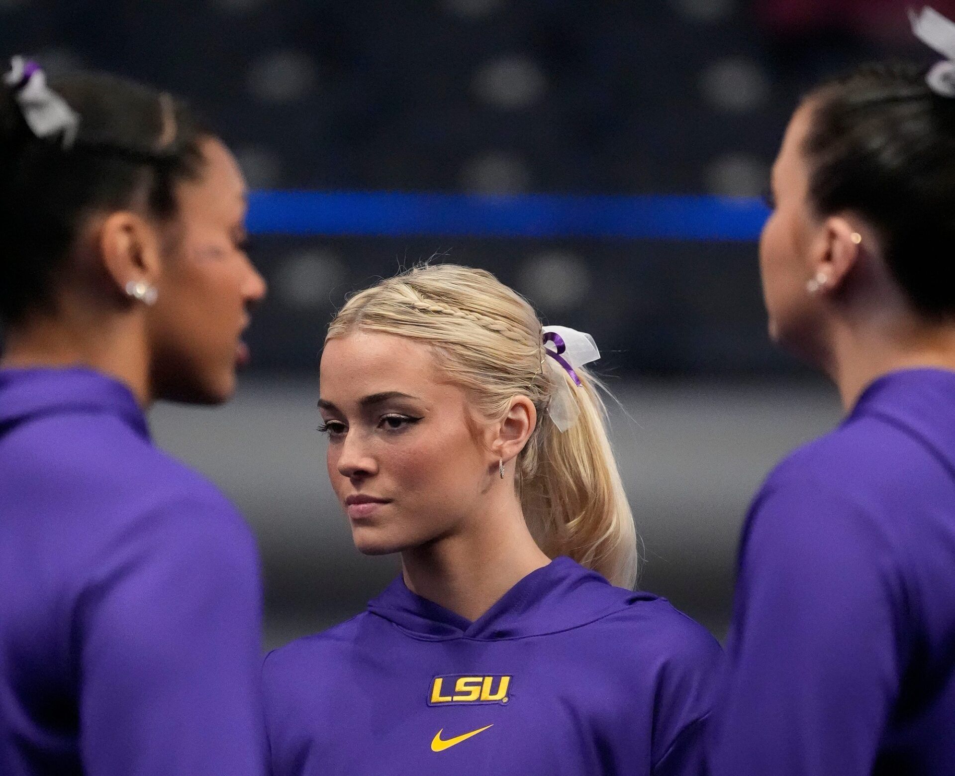 LSU gymnast Livvy Dunne stretches with teammates before Session 2 of the SEC Gymnastics Tournament at Legacy Arena in Birmingham, Alabama.