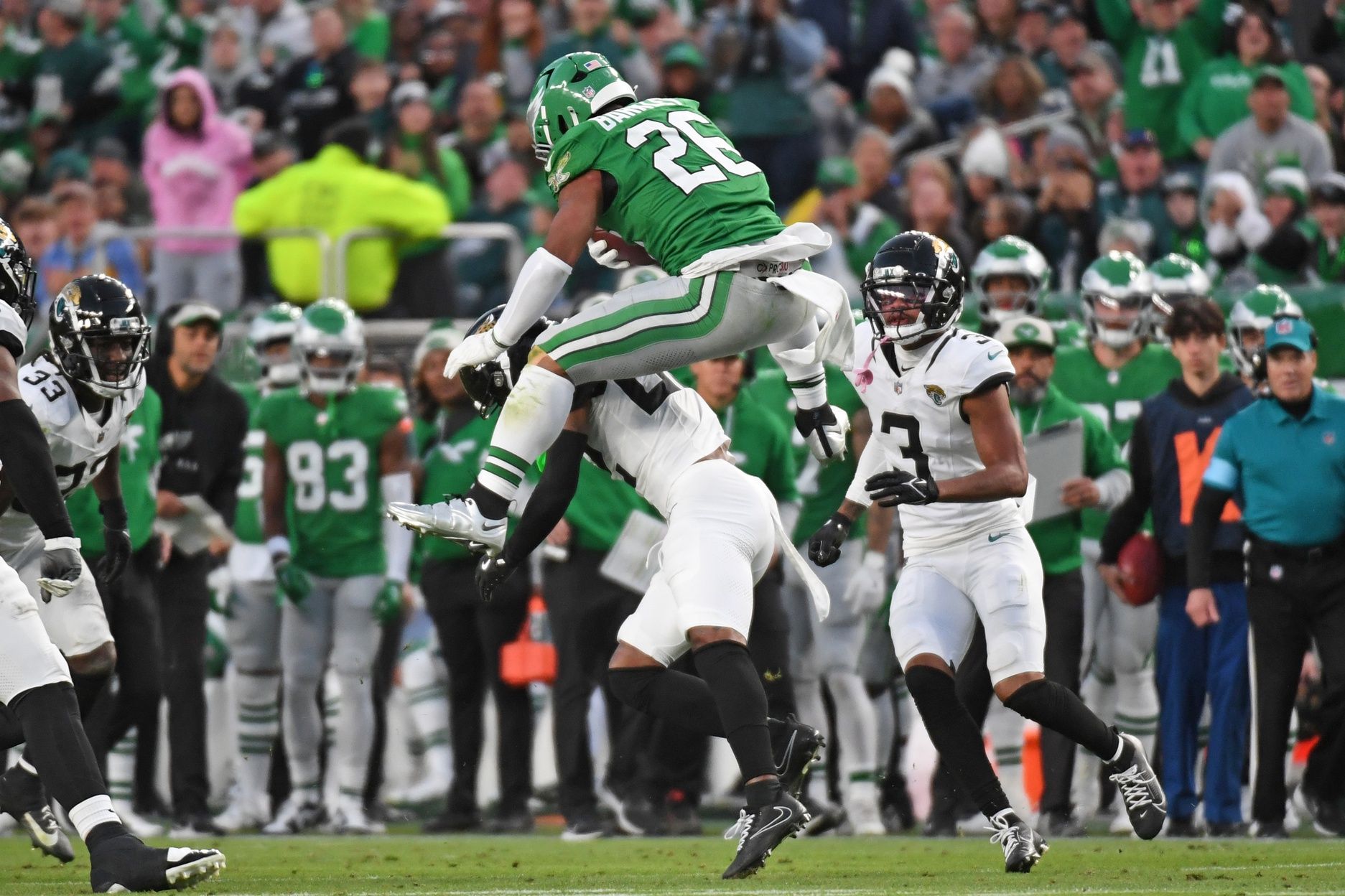Philadelphia Eagles running back Saquon Barkley (26) jumps over Jacksonville Jaguars cornerback Jarrian Jones (22) during the second quarter at Lincoln Financial Field.