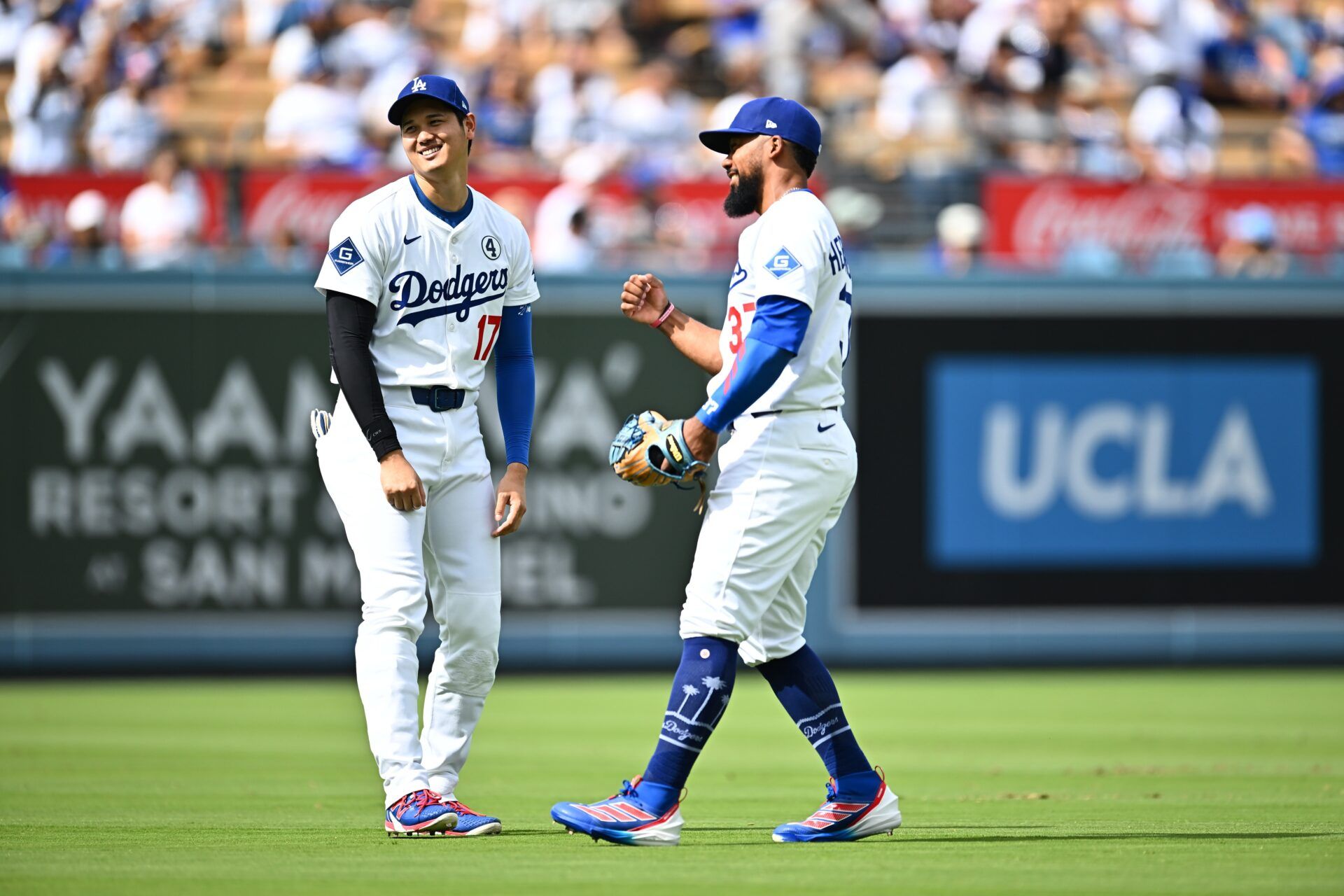 Los Angeles Dodgers designated hitter Shohei Ohtani (17) reacts with right fielder Teoscar Hernandez (37) on the field prior to the game against the New York Yankees at Dodger Stadium.