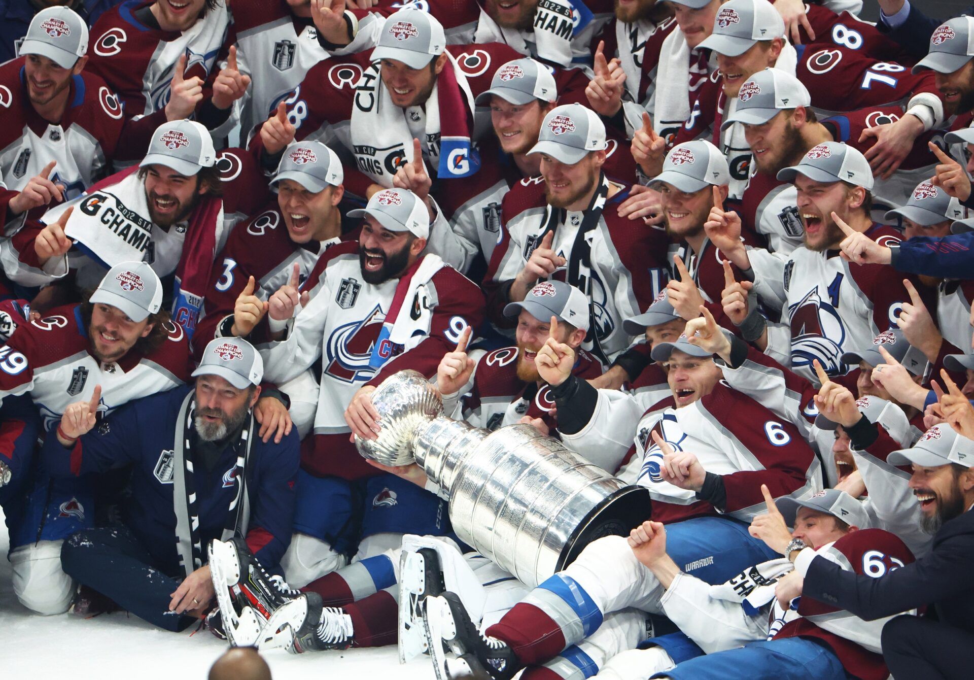 The Colorado Avalanche pose for a team photo with the Stanley Cup trophy after defeating the Tampa Bay Lightning to win the Stanley Cup in game six of the 2022 Stanley Cup Final at Amalie Arena.