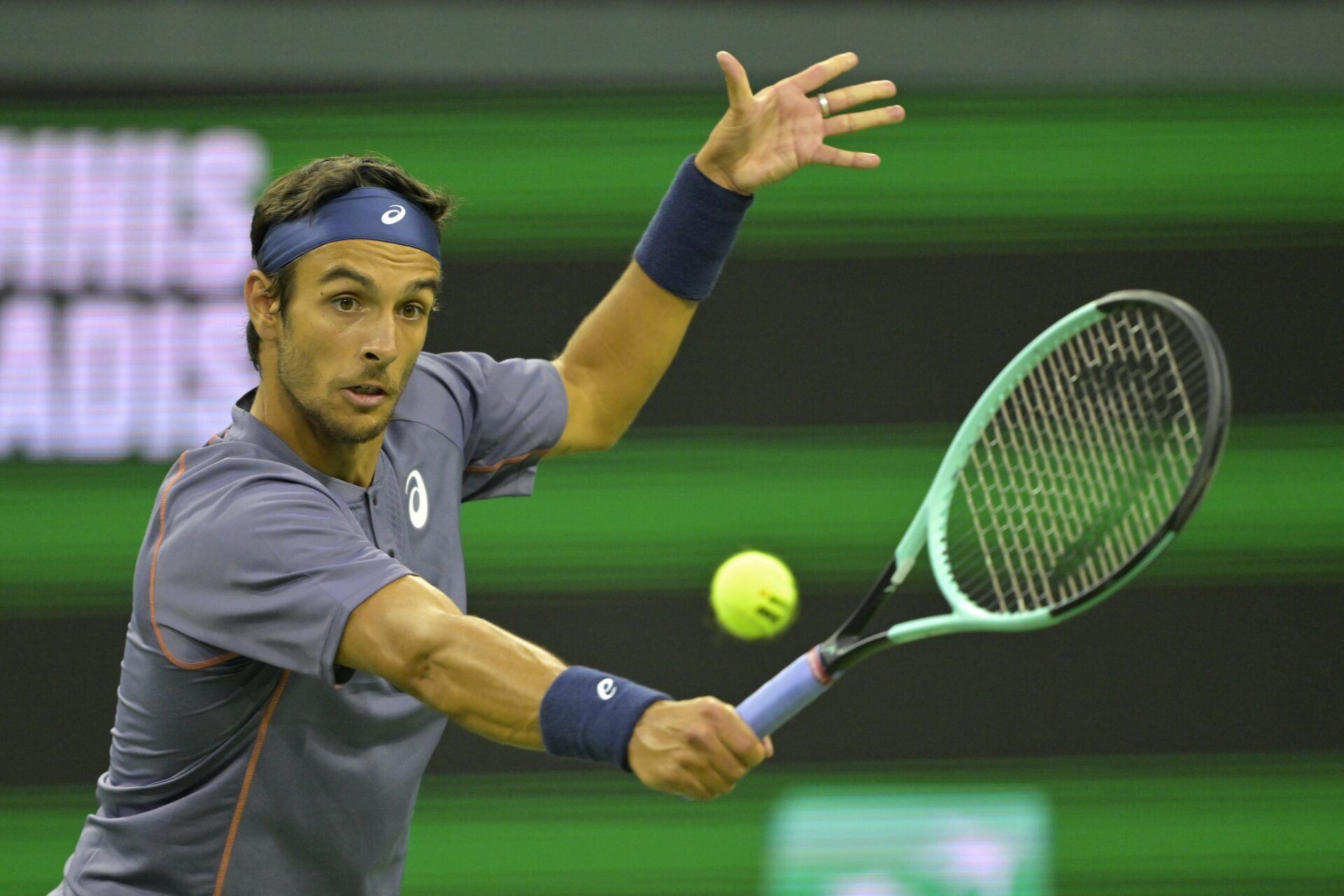 Lorenzo Musetti (ITA) hits a shot against Arthur Fils (not pictured) during his third round match in the BNP Paribas Open at the Indian Well Tennis Garden.