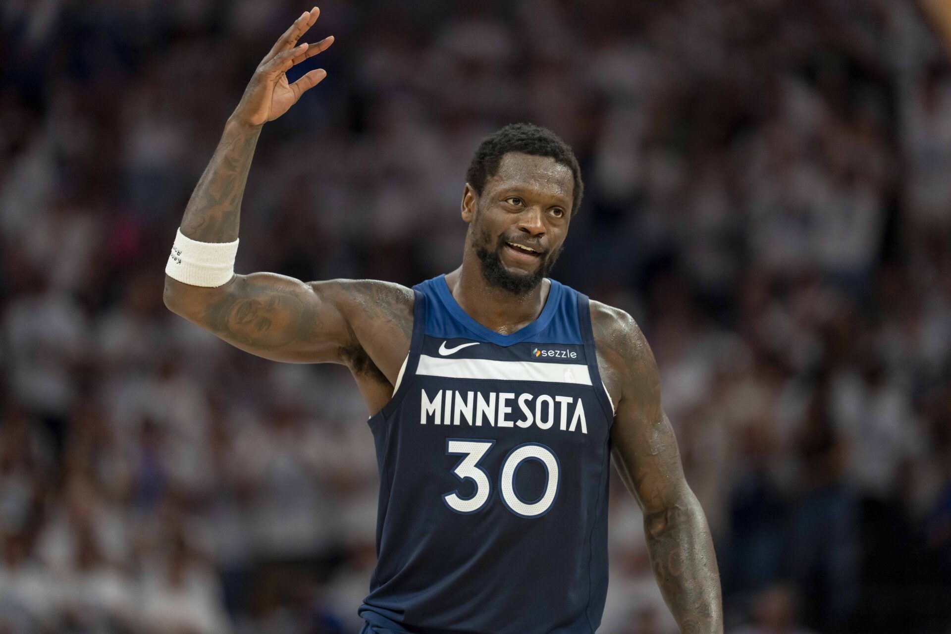 Minnesota Timberwolves forward Julius Randle (30) raises his arm to pump up the crowd after making a shot against the Golden State Warriors in the first half during game five of the second round for the 2025 NBA Playoffs at Target Center.