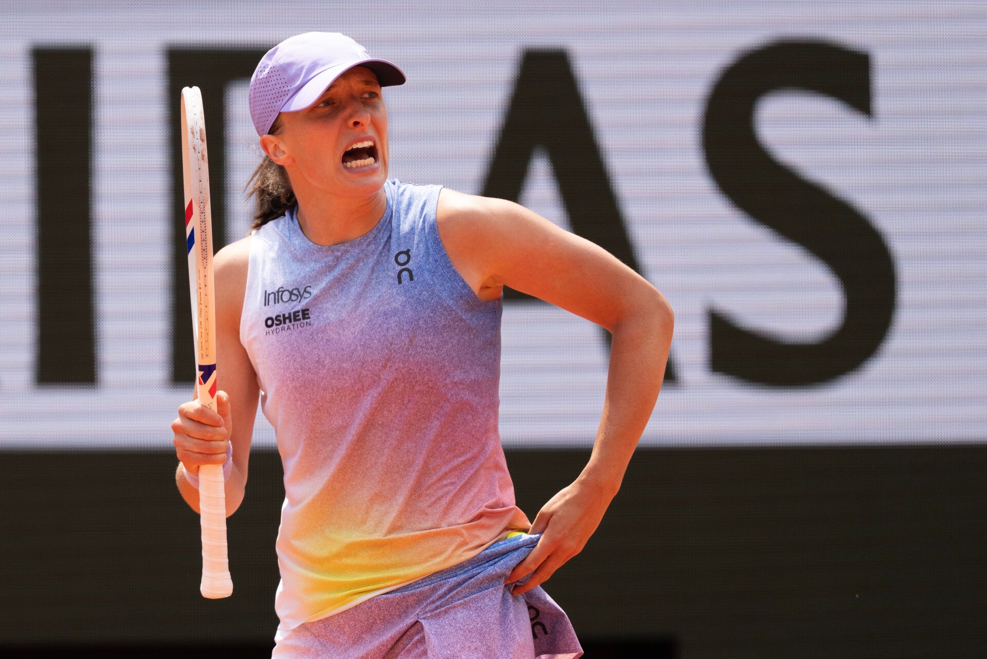 Iga Swiatek of Poland reacts to a point during her match against Elina Svitolina of Ukraine on day 10 at Roland Garros Stadium.
