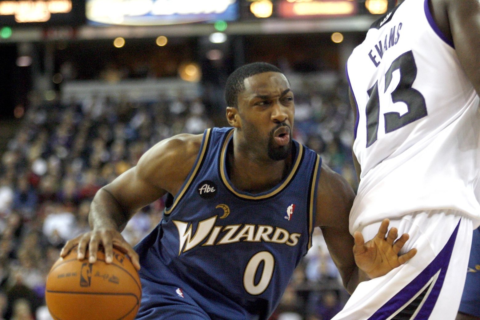 Washington Wizards guard Gilbert Arenas (0) tries to get around Sacramento Kings guard Tyreke Evans (13) in the first half at Arco Arena.