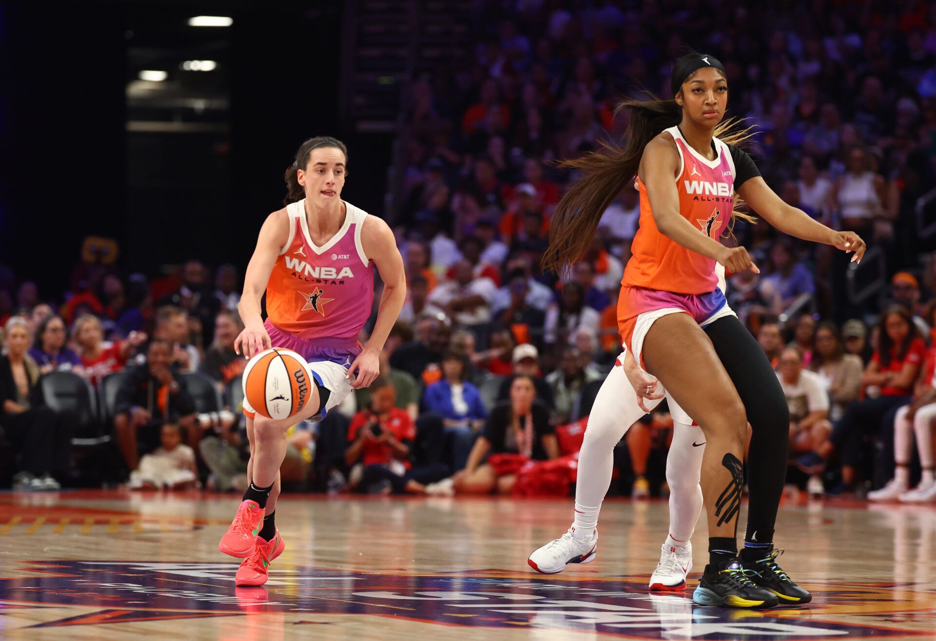 Team WNBA guard Caitlin Clark (left) and Angel Reese against the USA Women's National Team during the 2024 WNBA All Star Game at Footprint Center.
