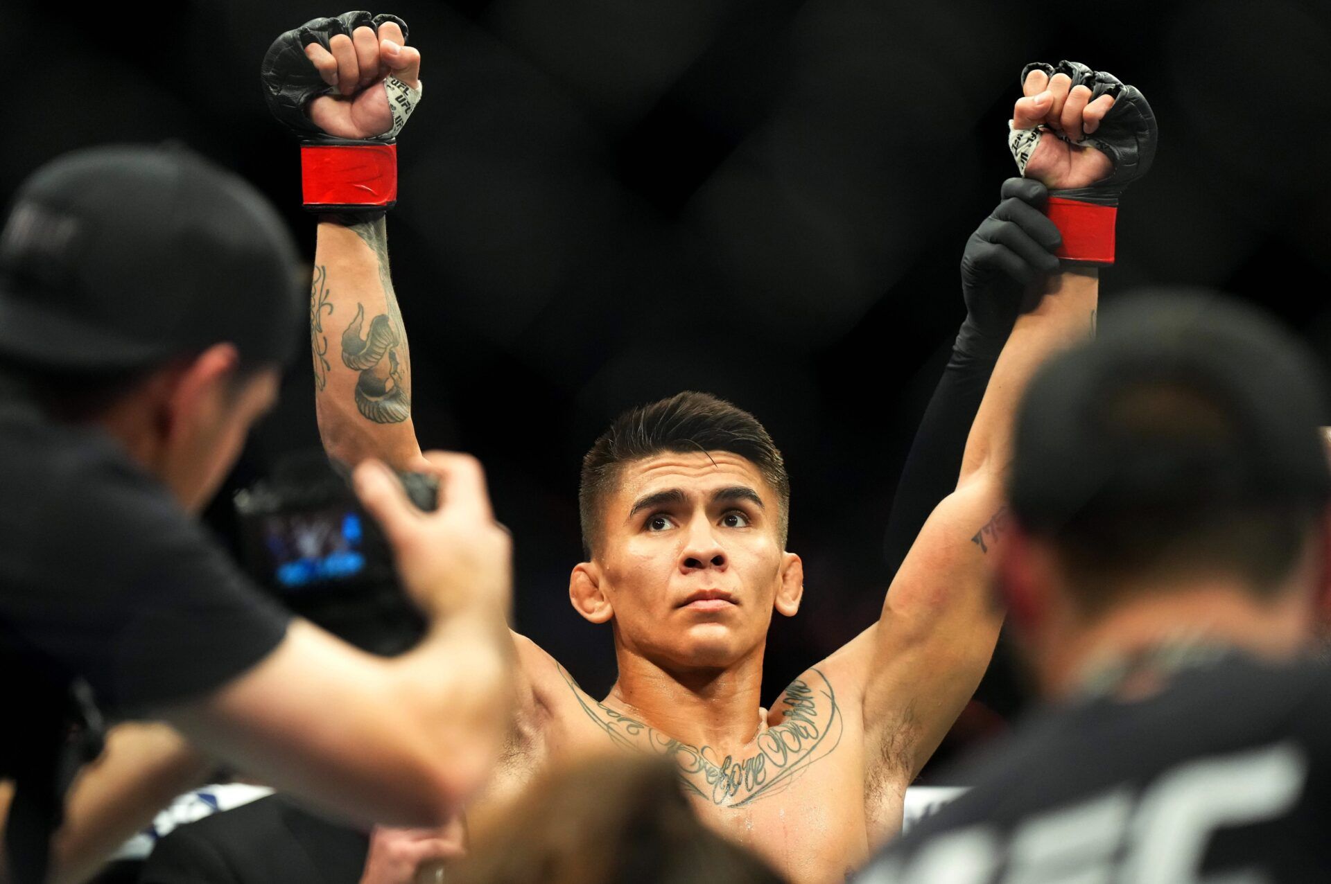 Mario Bautista (red gloves)reacts after defeating Cuido Cannetti (blue gloves) during UFC Fight Night at Virgin Hotel.