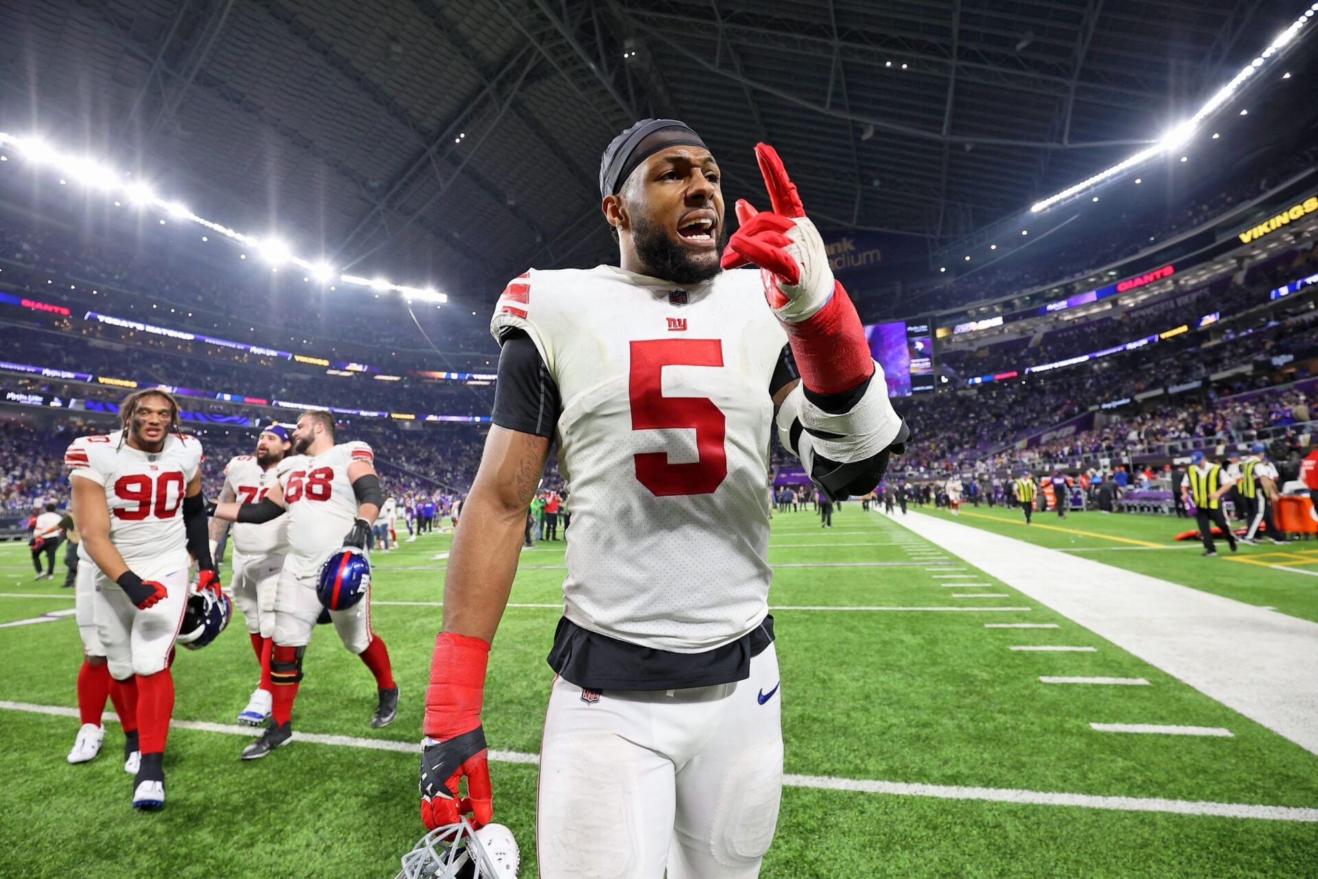 New York Giants defensive end Kayvon Thibodeaux (5) reacts after winning a wild card game against the Minnesota Vikings at U.S. Bank Stadium.