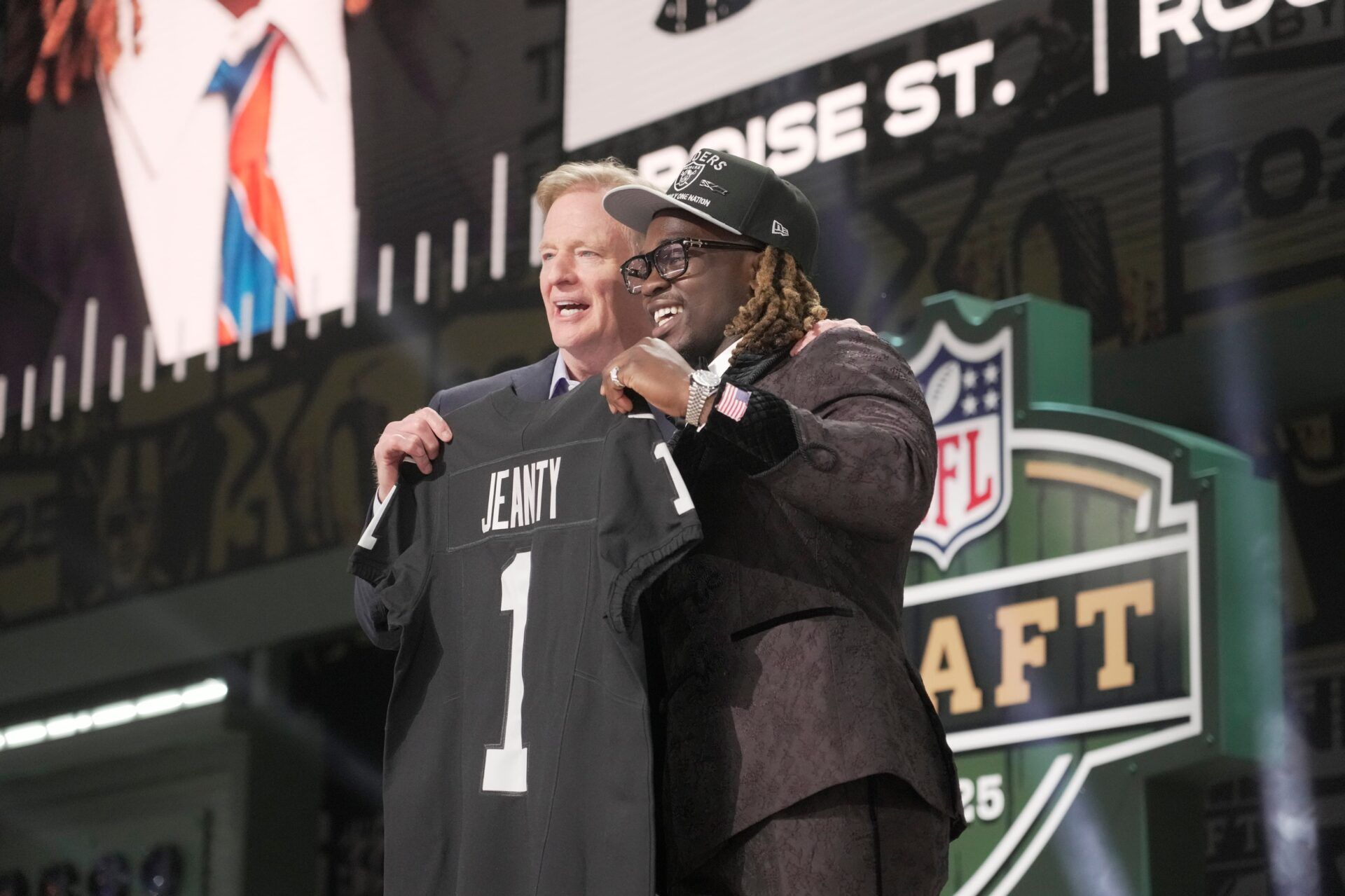 NFL Commissioner Rodger Goodell, left, with Boise State Broncos running back Ashton Jeanty is selected by the Las Vegas Raiders as the number six pick in the first round of the 2025 NFL Draft at Lambeau Field. Mark Hoffman / Milwaukee Journal Sentinel