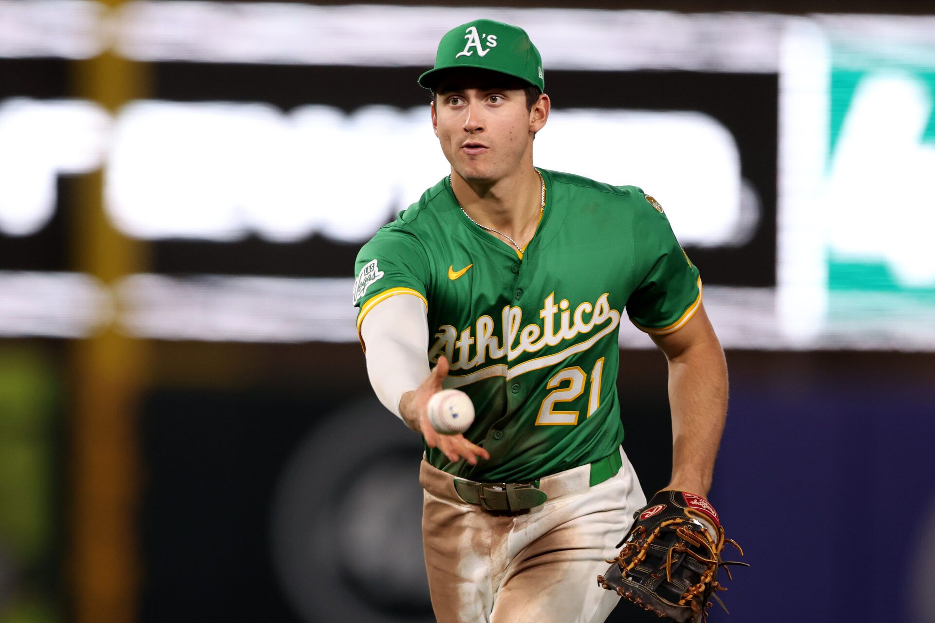 Athletics first baseman Tyler Soderstrom (21) tosses to first for an out against the Minnesota Twins during the sixth inning at Sutter Health Park.