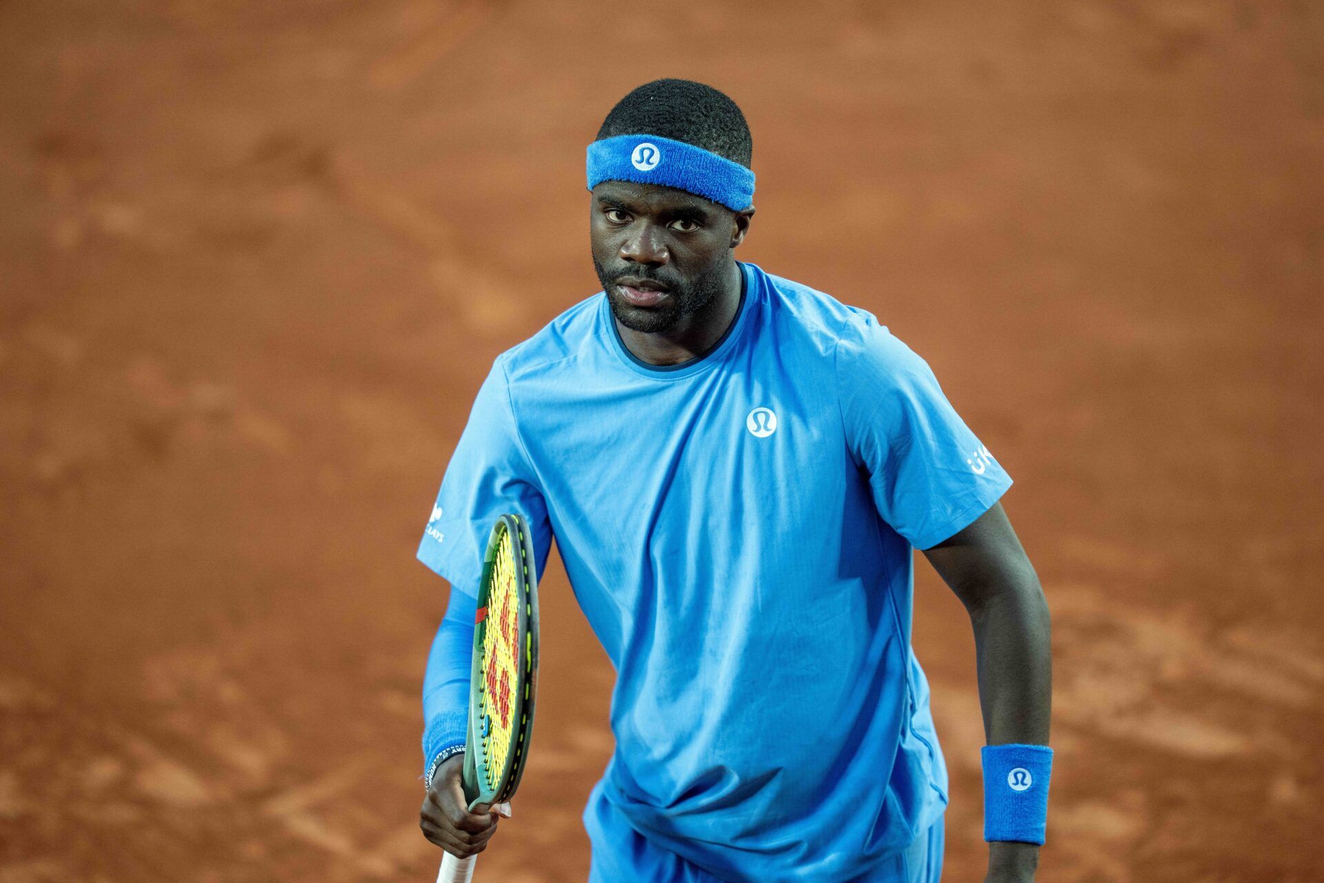 Frances Tiafoe of the United States reacts to a point during his match against Sebastian Korda of the United States on day six at Roland Garros Stadium.