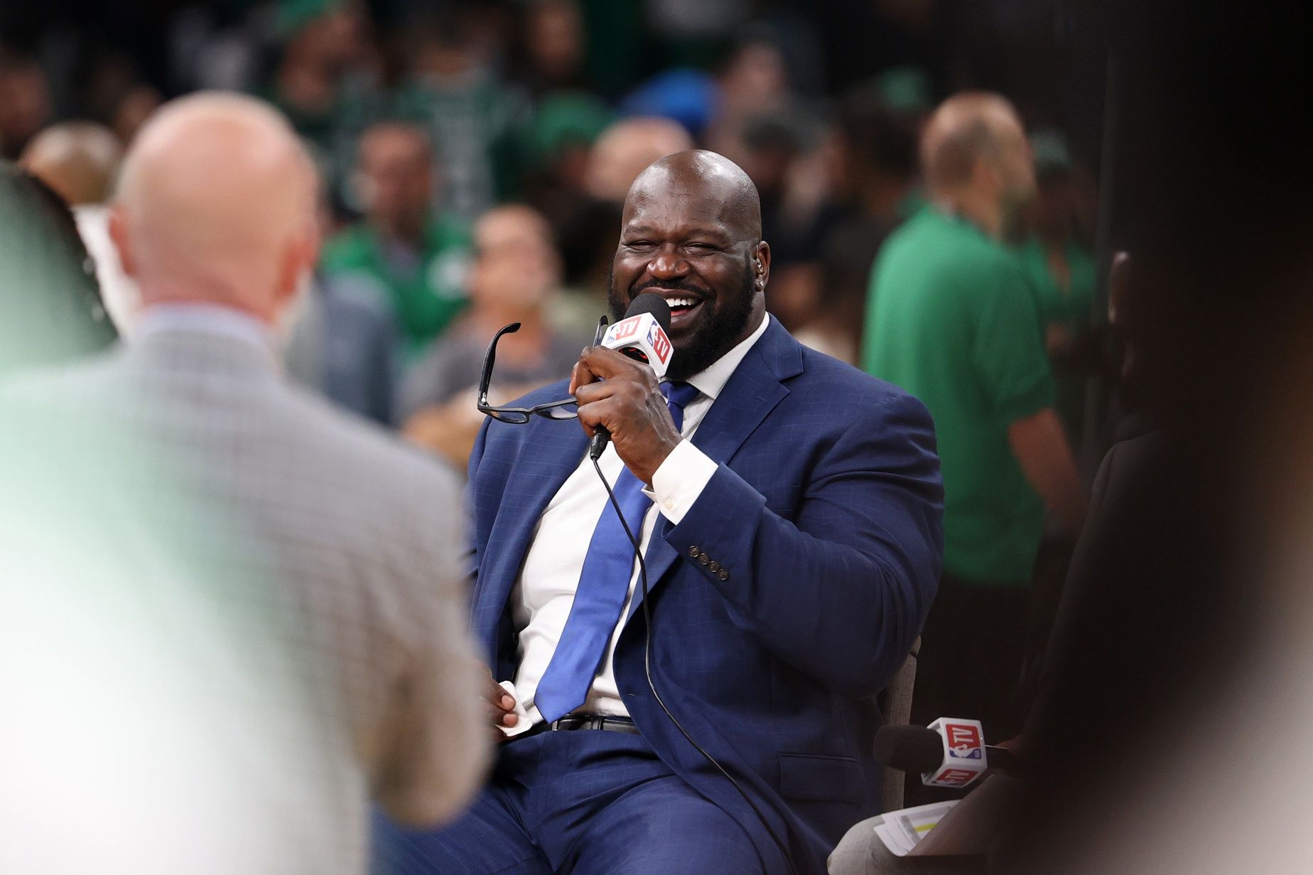 NBA former player Shaquille O'Neill laughs on the NBA TV set before game two of the 2024 NBA Finals between the Boston Celtics and the Dallas Mavericks at TD Garden.