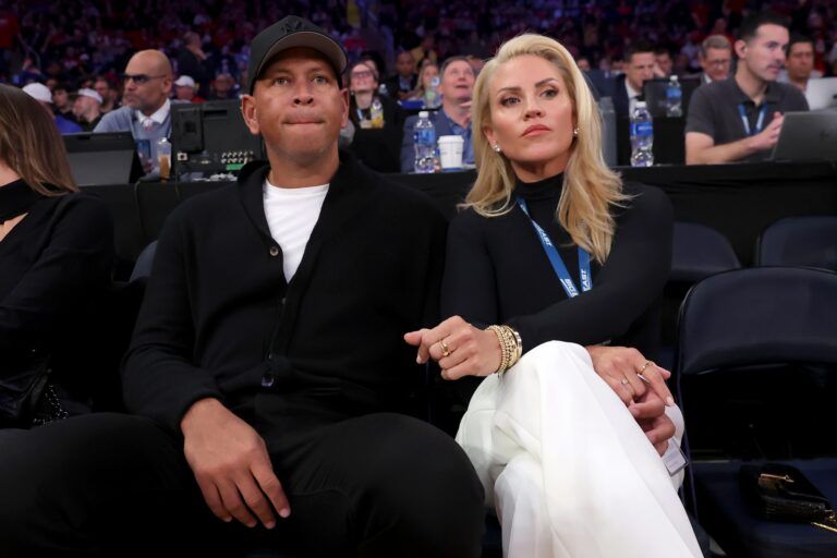 New York Yankees former player Alex Rodriguez and his girlfriend Jaclyn Cordeiro sit court side during the first half between the St. John's Red Storm and the Creighton Bluejays at Madison Square Garden.