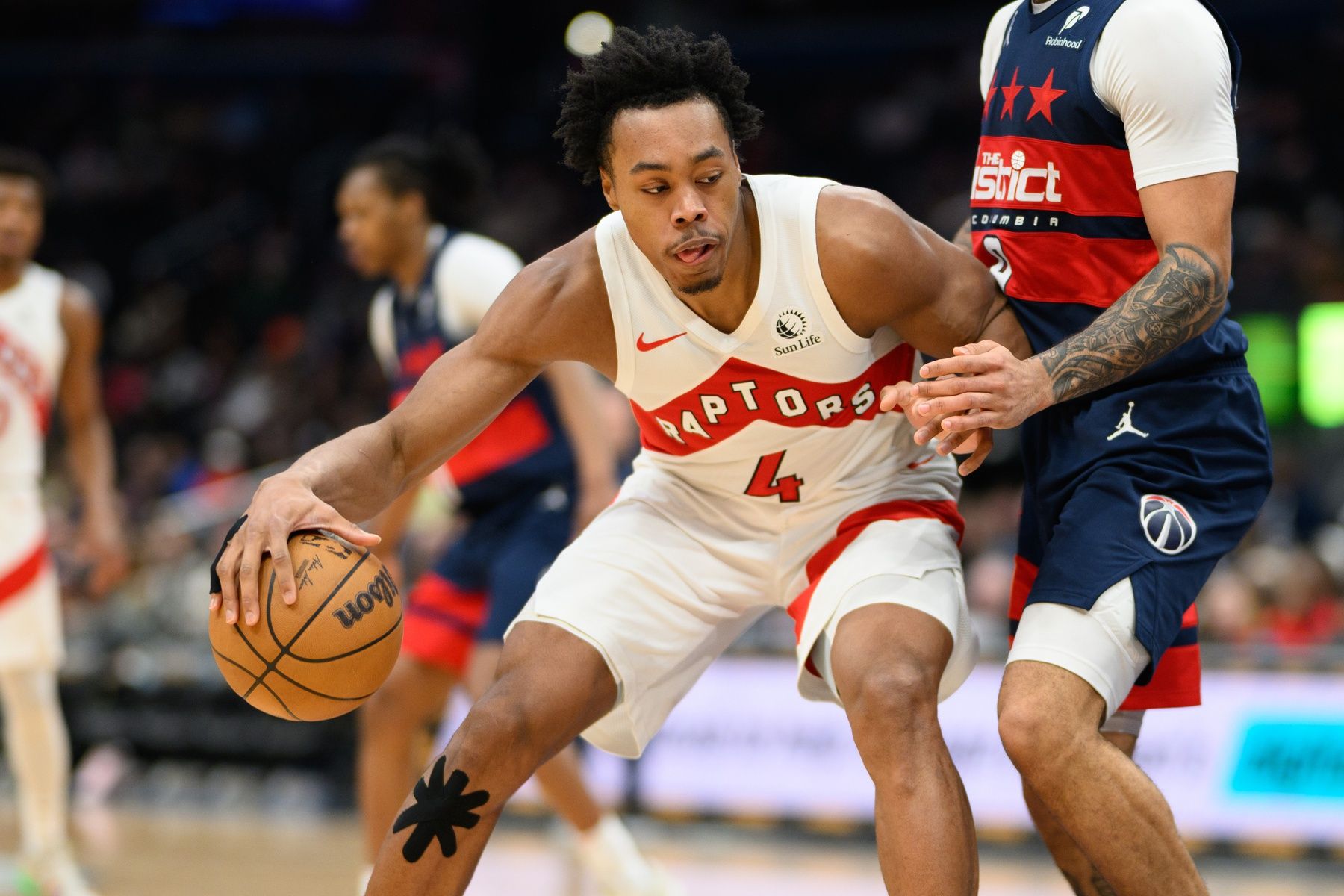 Toronto Raptors forward Scottie Barnes (4) handles the ball during the third quarter against the Washington Wizards at Capital One Arena.