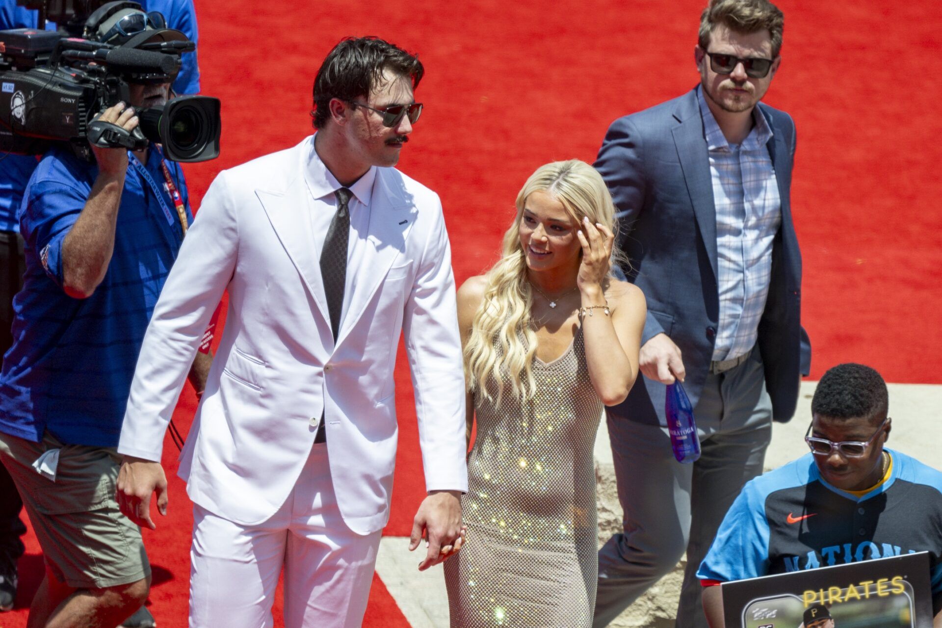 National League pitcher Paul Skenes of the Pittsburgh Pirates walks the red carpet with his girlfriend LSU gymnast Olivia Livvy Dunne before the 2024 MLB All-Star game at Globe Life Field.