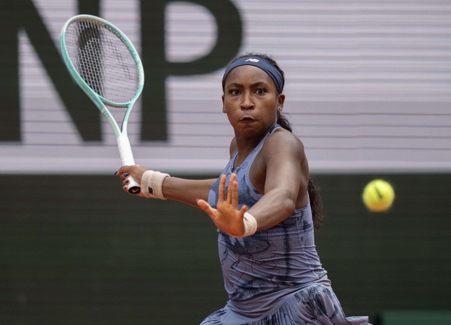 Coco Gauff of the United States returns a shot during her match against Marie Bouzkova of the Czech Republic  on day seven at Roland Garros Stadium.