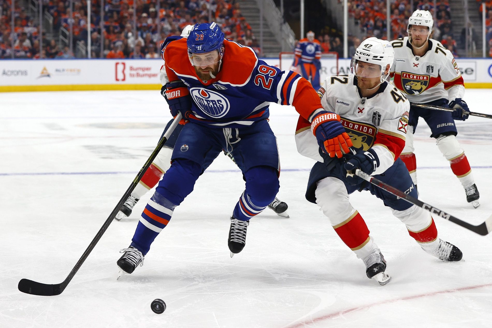 Edmonton Oilers center Leon Draisaitl (29) skates with the puck past Florida Panthers defenseman Gustav Forsling (42) during the first period in game one of the 2025 Stanley Cup Final at Rogers Place.