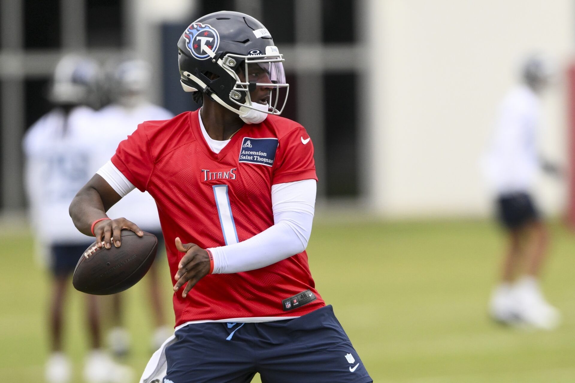 Tennessee Titans quarterback Cam Ward (1) throws a pass as he goes through drills during Rookie Mini Camp at Saint Thomas Sports Park.