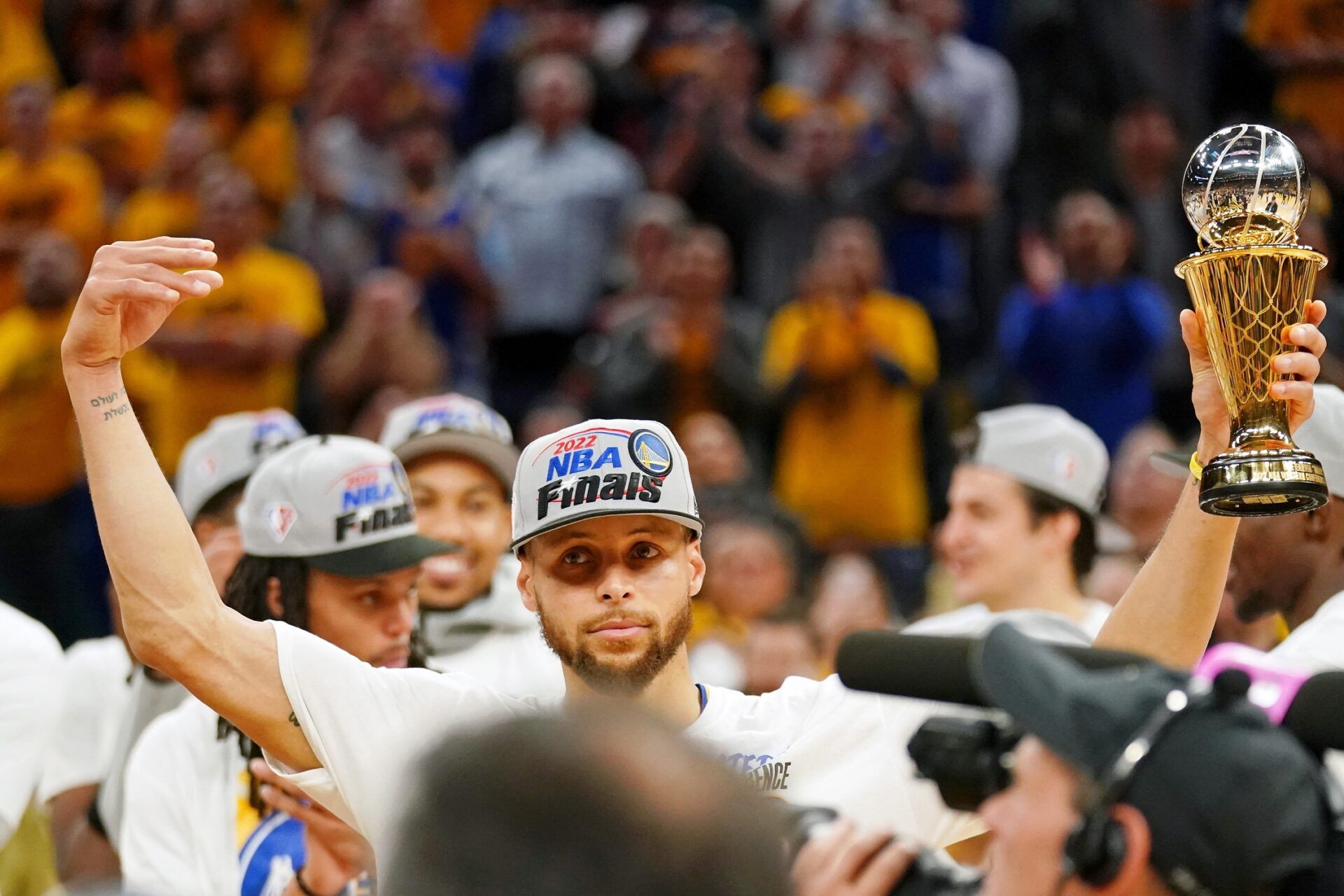 Golden State Warriors guard Stephen Curry (30) reacts after he was named the Magic Johnson western conference MVP after winning game five of the 2022 western conference finals against the Dallas Mavericks at Chase Center.