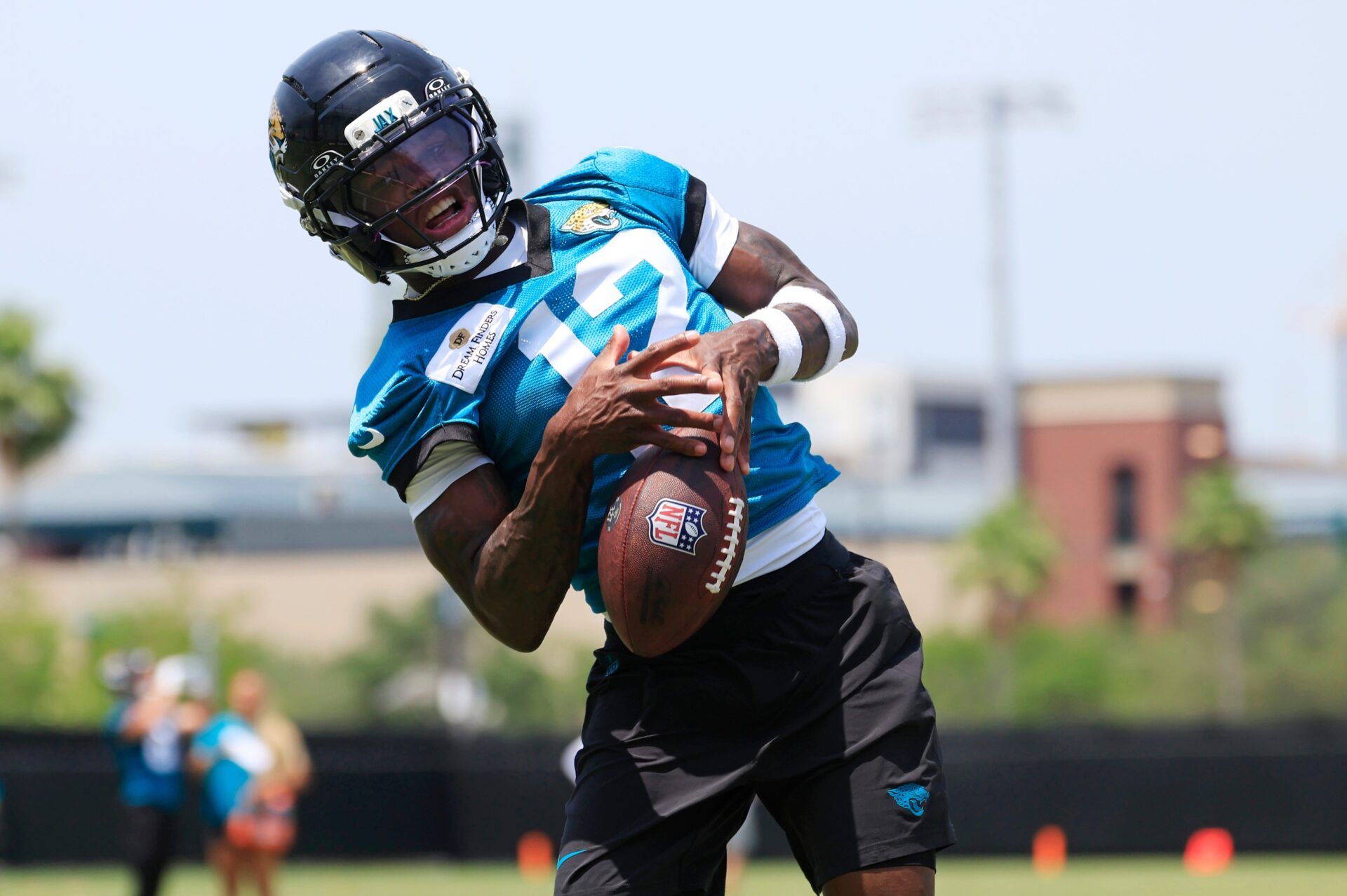 Jacksonville Jaguars wide receiver Travis Hunter (12) can't haul in a reception during the first organized team activity at Miller Electric Center Monday, May 19, 2025 in Jacksonville, Fla.