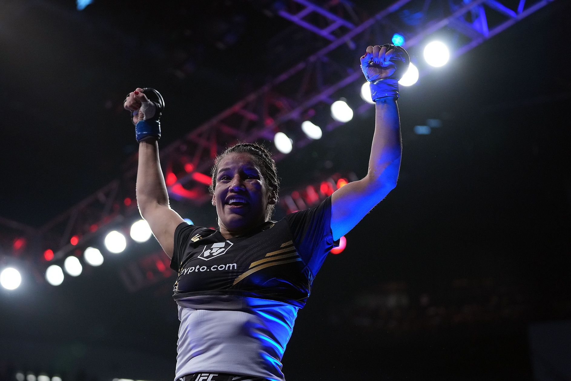 Julianna Pena celebrates her victory by submission against Amanda Nunes during UFC 269 at T-Mobile Arena.