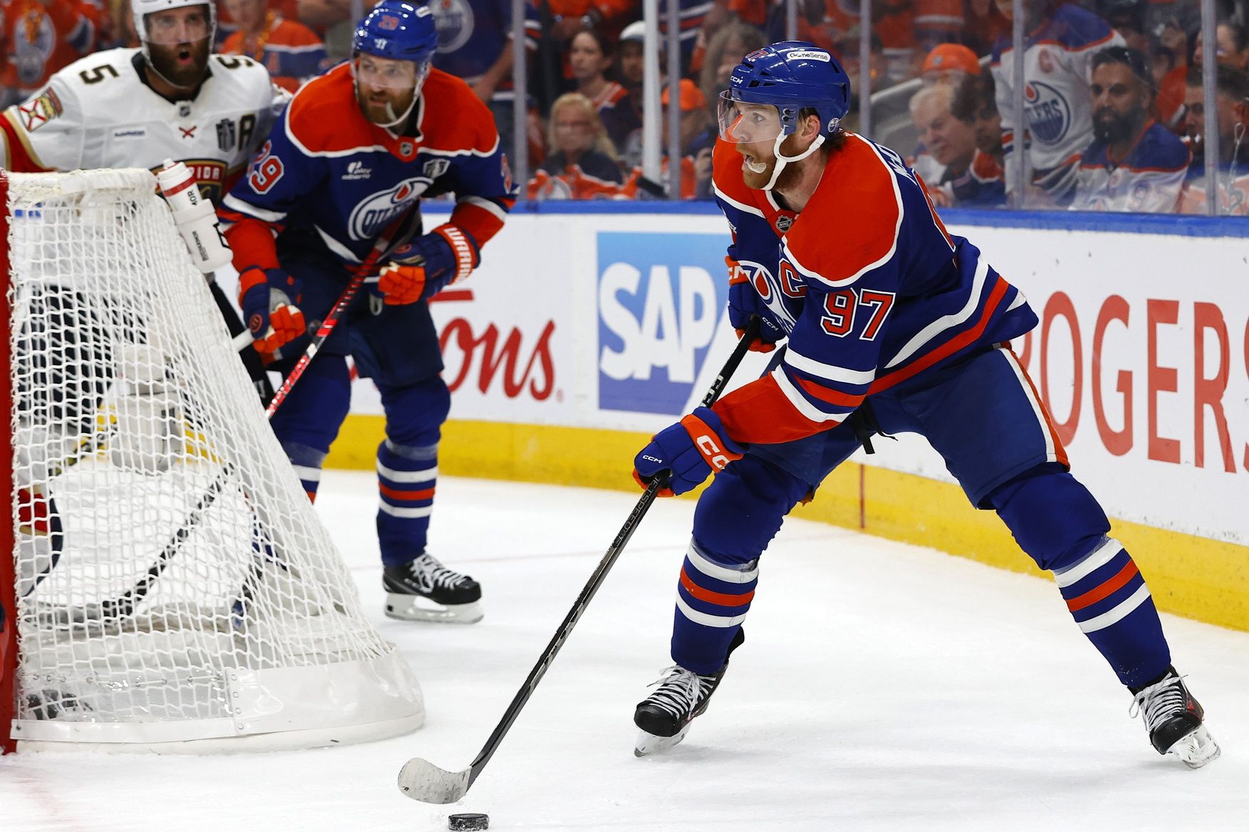 Edmonton Oilers center Connor McDavid (97) skates with the puck against the Florida Panthers in the third period in game one of the 2025 Stanley Cup Final at Rogers Place.