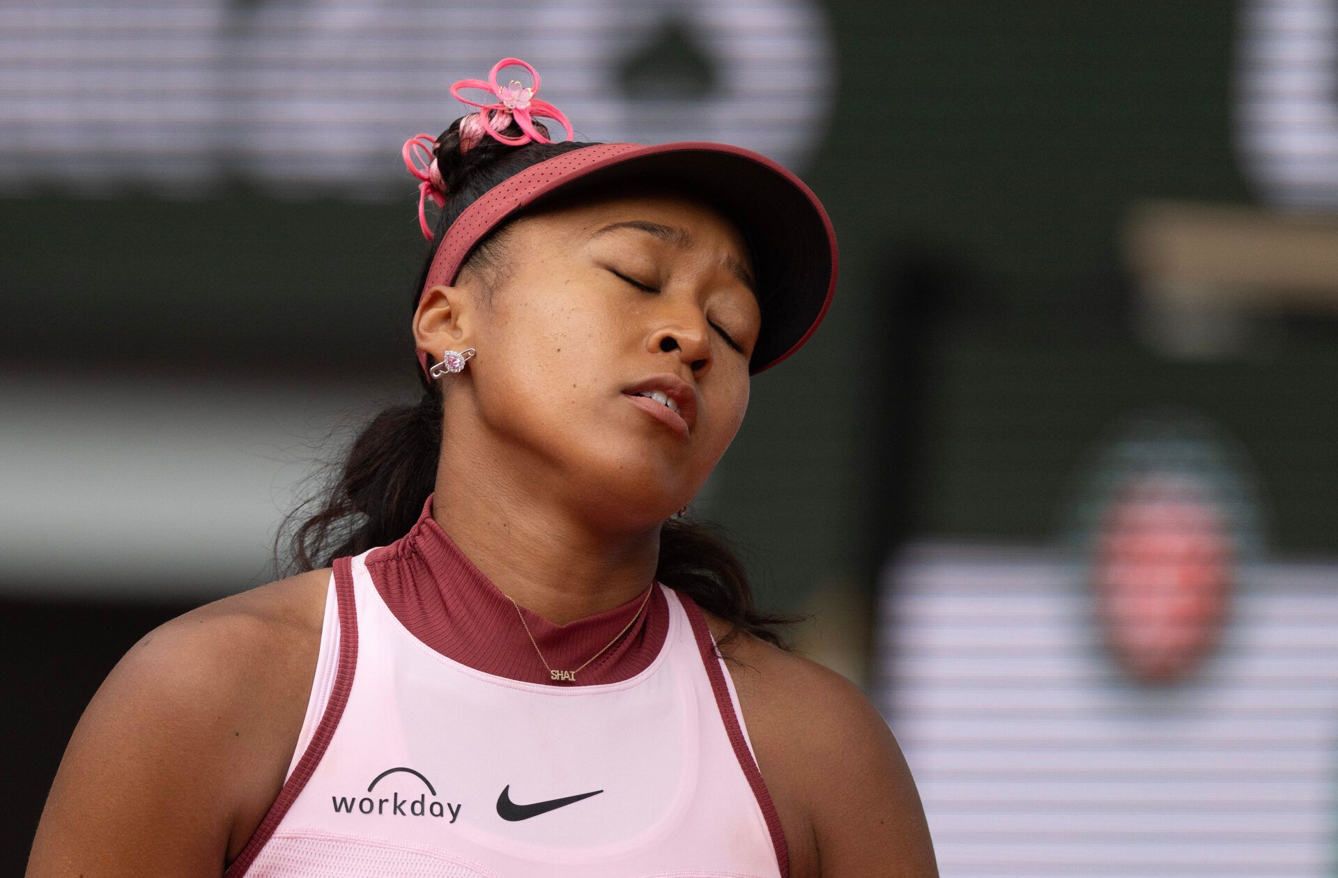 Naomi Osaka of Japan reacts to a point during her match against Paula Badosa of Spain on day two at Roland Garros Stadium.