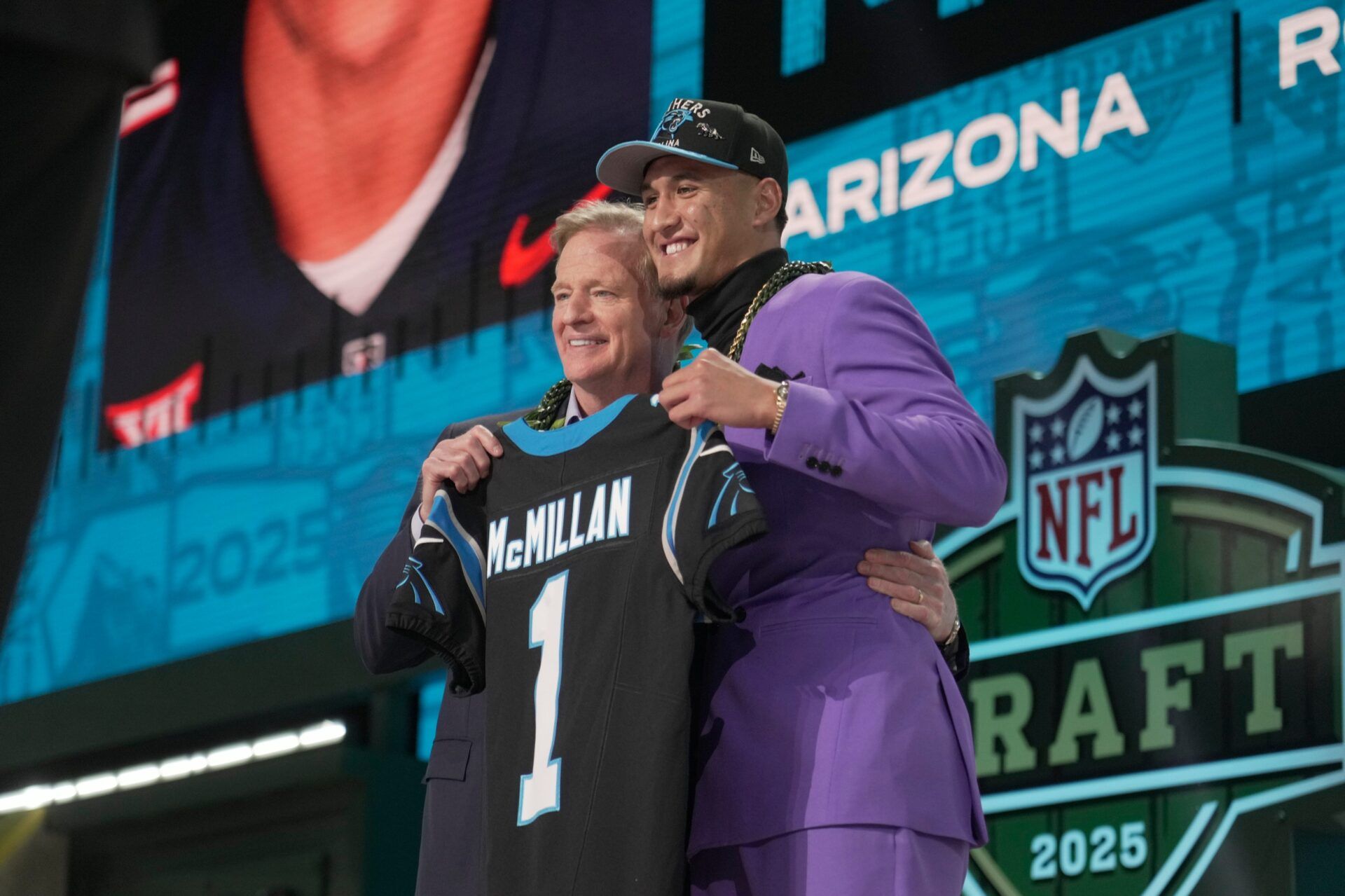 NFL Commissoner Rodger Goodell, left, with Arizona Wildcats wide receiver Tetairoa McMillan selected by the Carolina Panthers as the number eight pick in the first round of the 2025 NFL Draft at Lambeau Field.