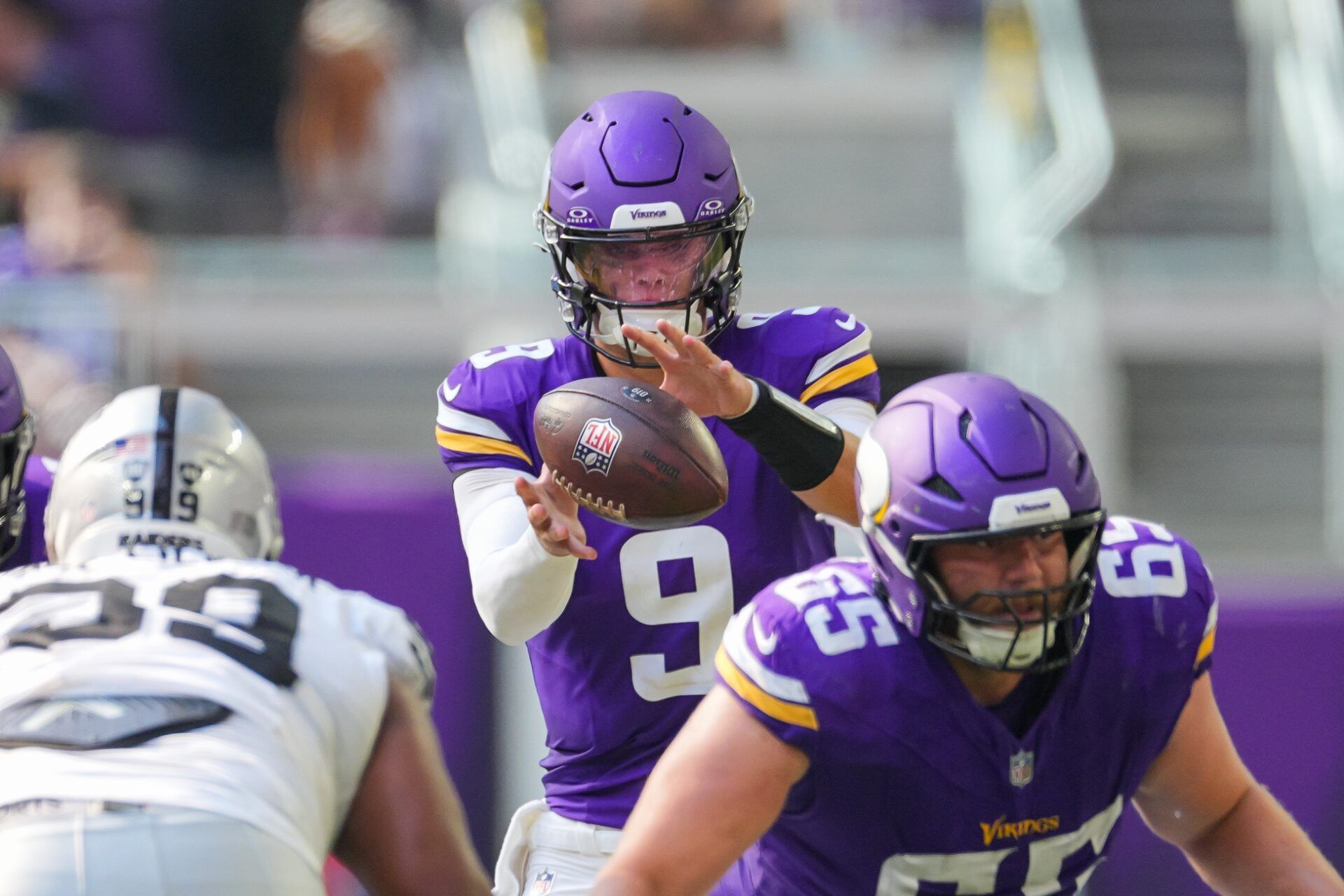 Minnesota Vikings quarterback J.J. McCarthy (9) takes the snap against the Las Vegas Raiders in the third quarter at U.S. Bank Stadium.