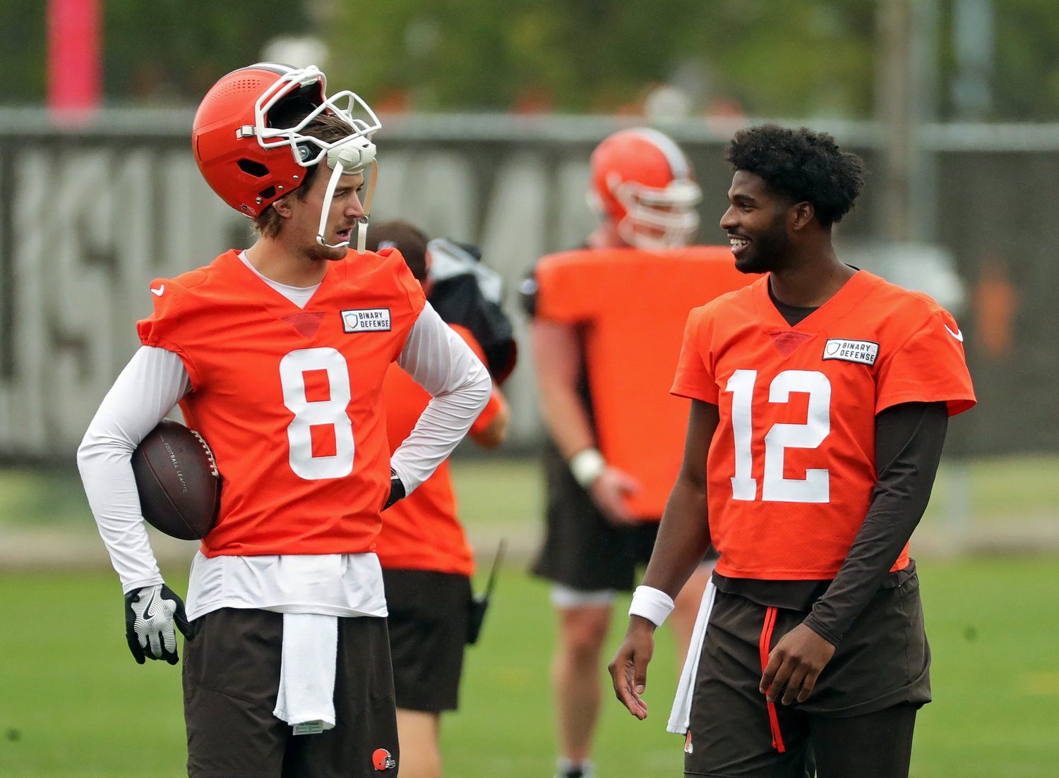 Cleveland Browns quarterback Kenny Pickett, left, chats with quarterback Shedeur Sanders (12) during an NFL practice at the Cleveland Browns training facility on Wednesday, May 28, 2025, in Berea, Ohio.