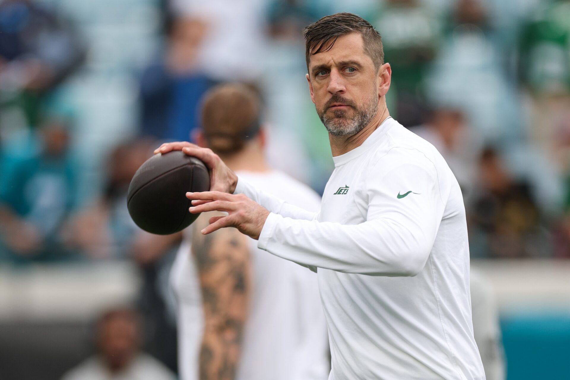 New York Jets quarterback Aaron Rodgers (8) warms up before a game against the Jacksonville Jaguars at EverBank Stadium.